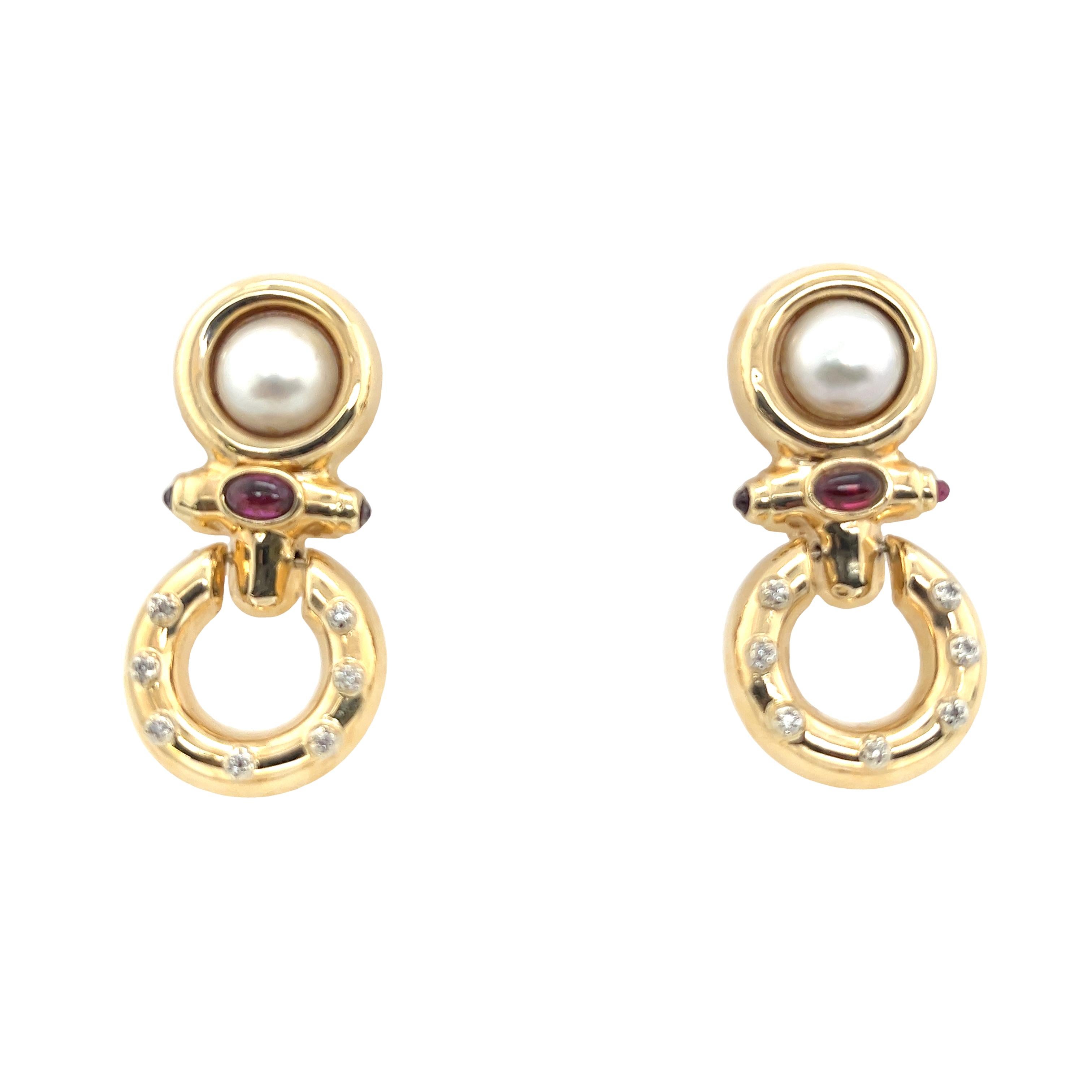 This vintage pair of drop pearl, ruby and diamond earrings are beautiful. 
Are set in 14ct yellow gold with clip on fittings,
set with 14 round diamonds.
Total Weight: 11.55g 
Earrings Dimension: 41.45mm x 20.50mm
Pearl: 9.20mm
Ruby: 6mm
SMS9251