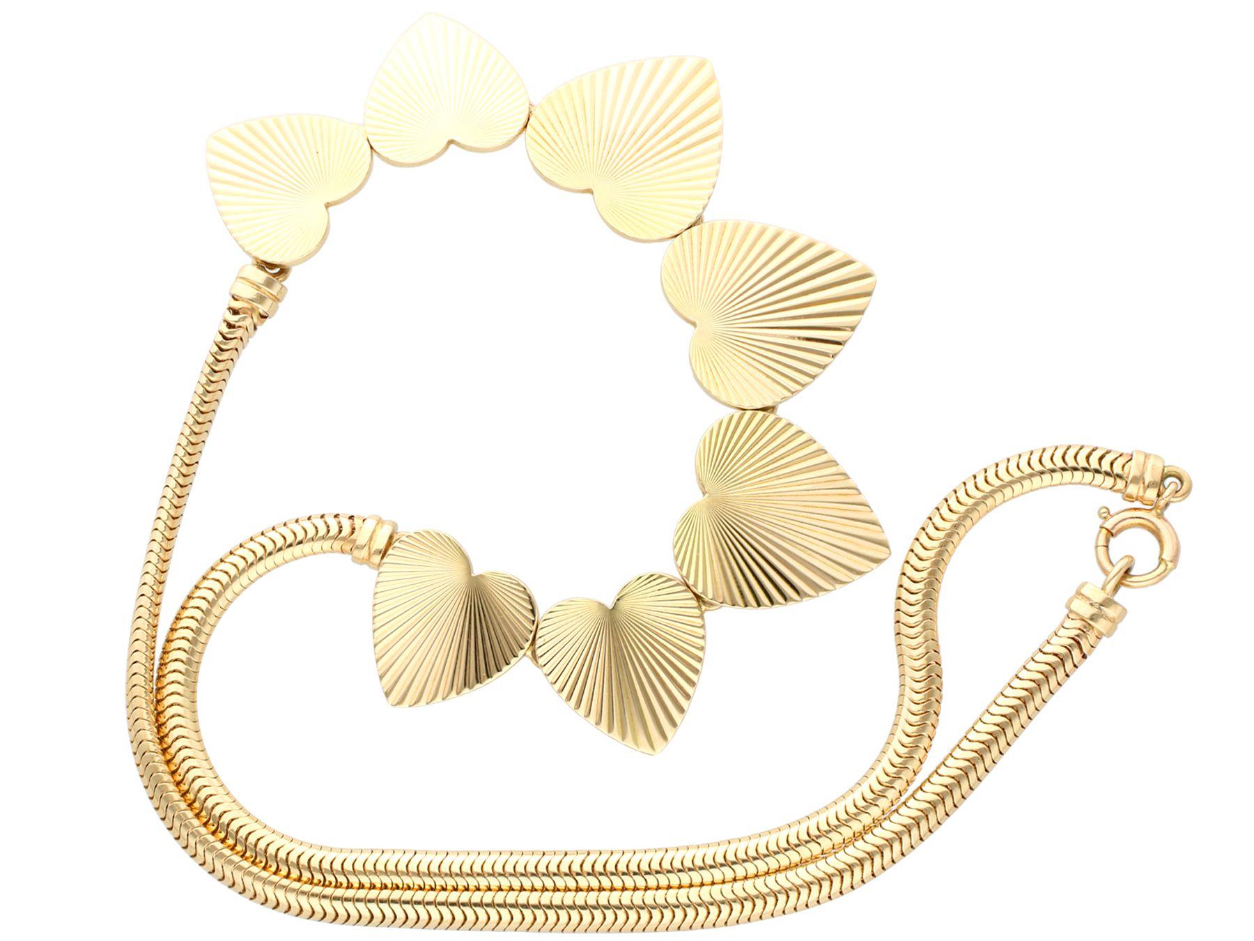A stunning, fine and impressive vintage 14 karat yellow gold heart necklace made by Tiffany & Co; part of our diverse vintage and estate jewelry collections.

This stunning, fine and impressive vintage necklace has been crafted in 14k yellow