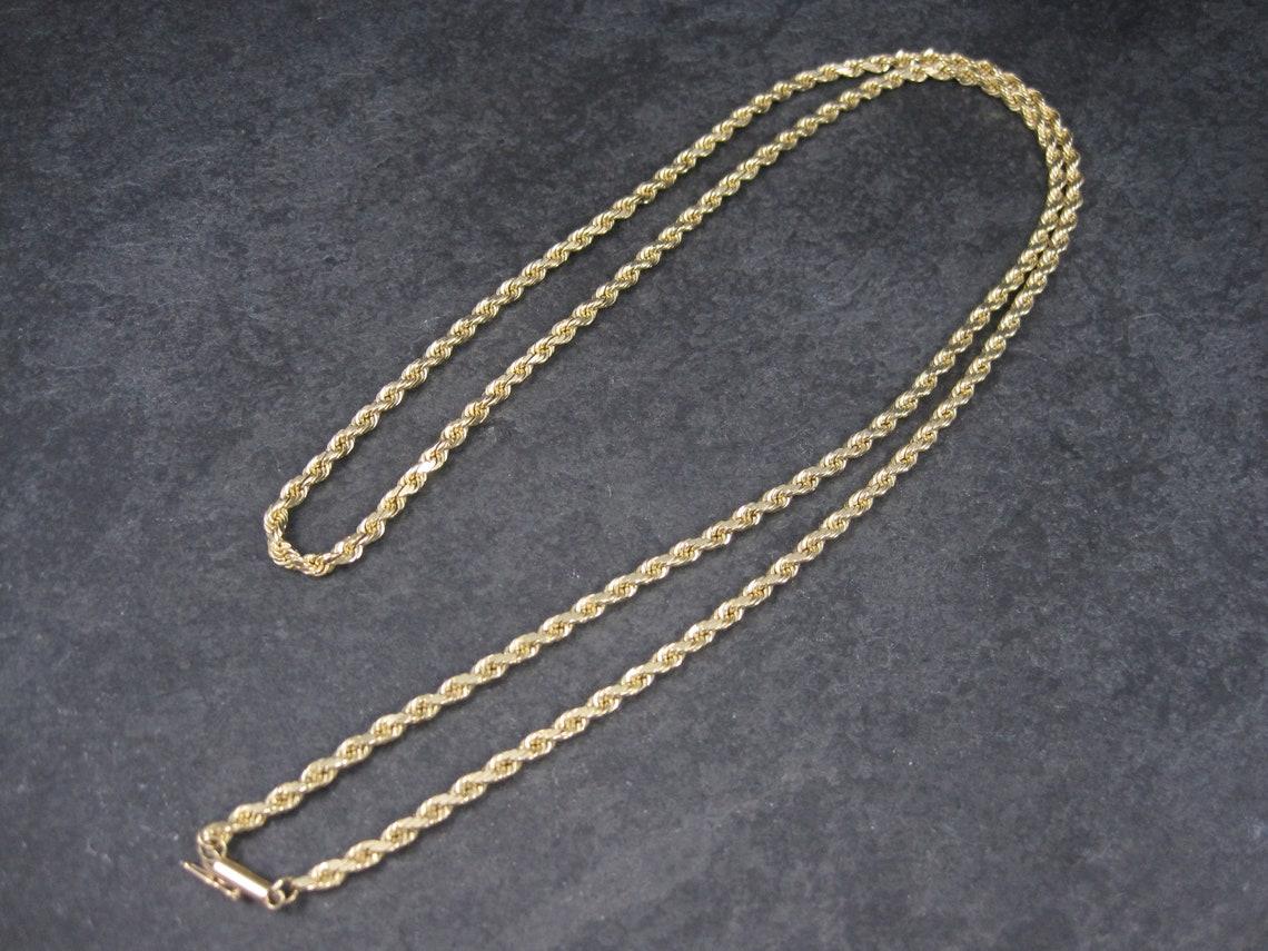 This gorgeous vintage rope chain is solid 14k yellow gold.

It measures 3.5mm wide and is 29 inches from end to end.
It has a round, box type clasp with safety catch.

Marks: 34.3 grams