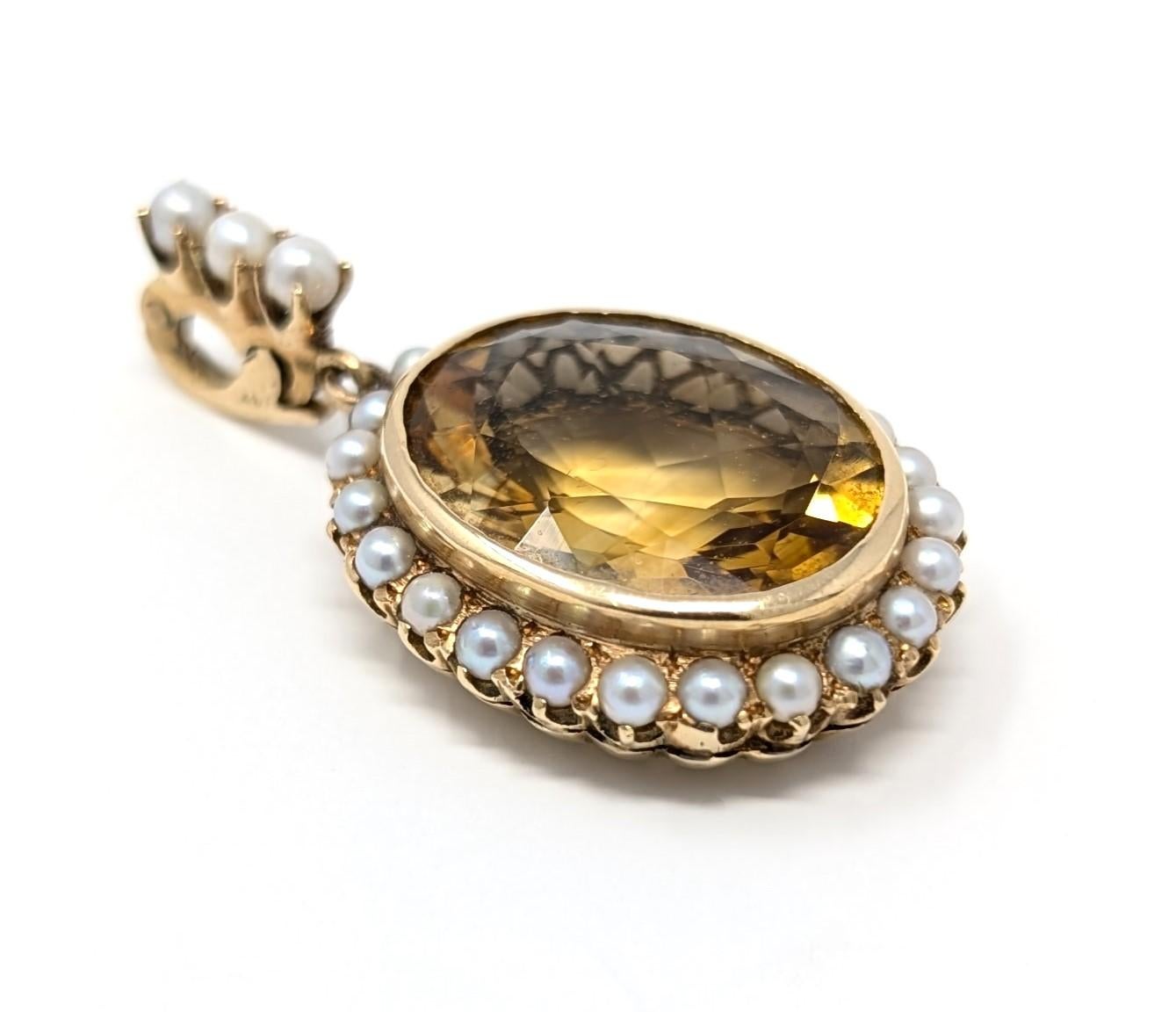 Stunning vintage 14k solid yellow gold pendant featuring a dazzling oval citrine centerpiece surrounded by pearls. Stamped 14K on the bail, measures .85 inch in width by .35 inch in depth and has a total drop length of 1.5 inches (from the bail to