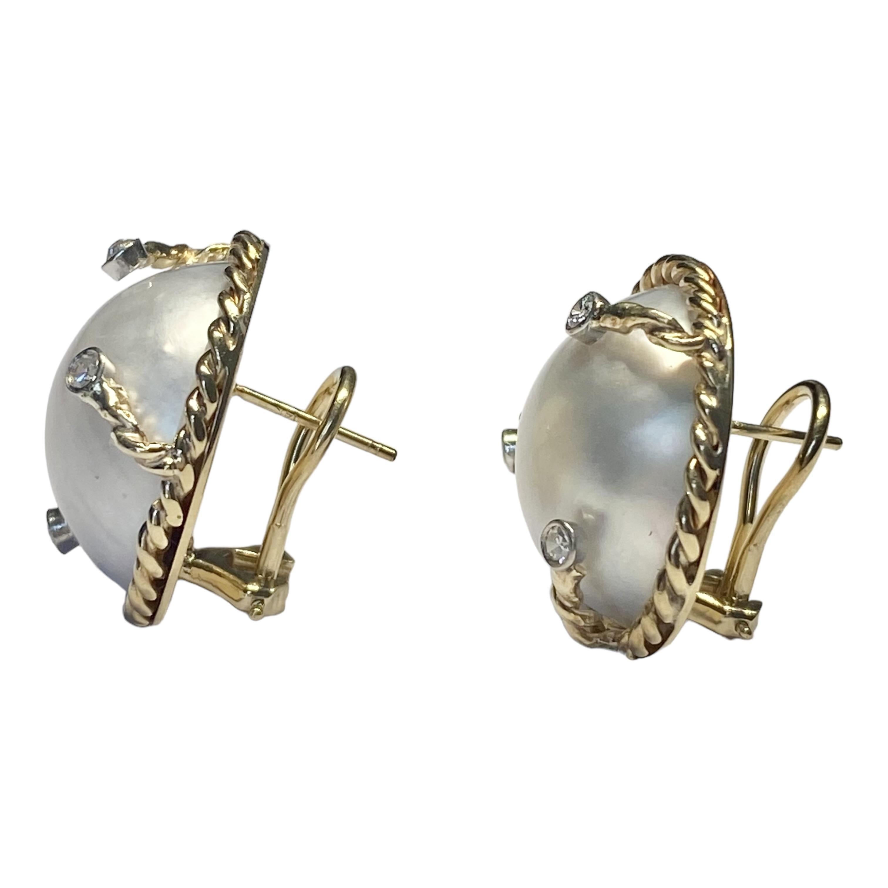 Crafted in 14K gold, each earring features an 18.5 mm round white mabe pearl set in a yellow gold rope bezel, accented by three white gold bezel set diamonds.
Post and omega backs for extra security.
6 round cut diamonds: approx. 0.18ctw. Color: