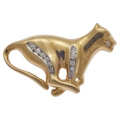 Broche panthère défilée vintage en or jaune 14 carats et diamants, chat léopard Jaguar