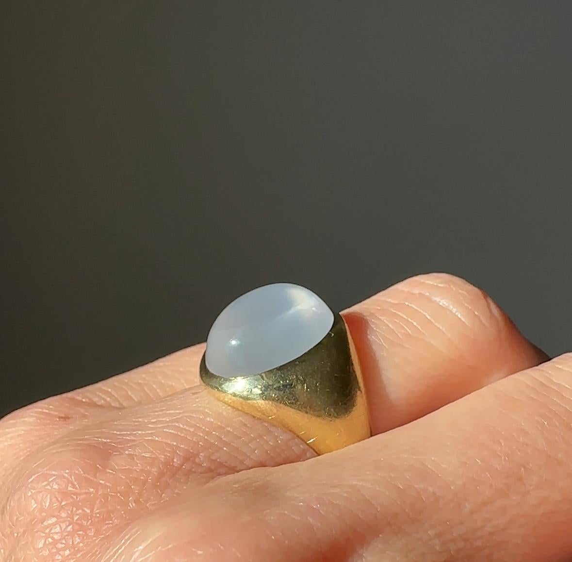 This sleek mid-twentieth century ring features a glowing 9.3 carat moonstone flush set in 14 karat yellow gold. Currently a ring size 6.75

 

Weight: 10.2 grams

Moonstone 14.19 x 11.37 x 6.7 mm - estimated 9.3 carats

Markings: 1(S)4