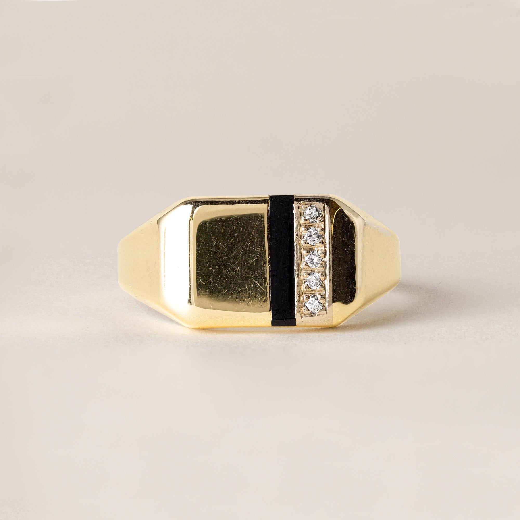 This is a vintage gold ring featuring a striped onyx inlay and
a sliver of pave set diamonds
Circa 1980's
Details:
5 round brilliant diamonds pave set
weigh~0.05 carats
Champagne SI color and clarity
10.7mm at it's widest point tapering down to