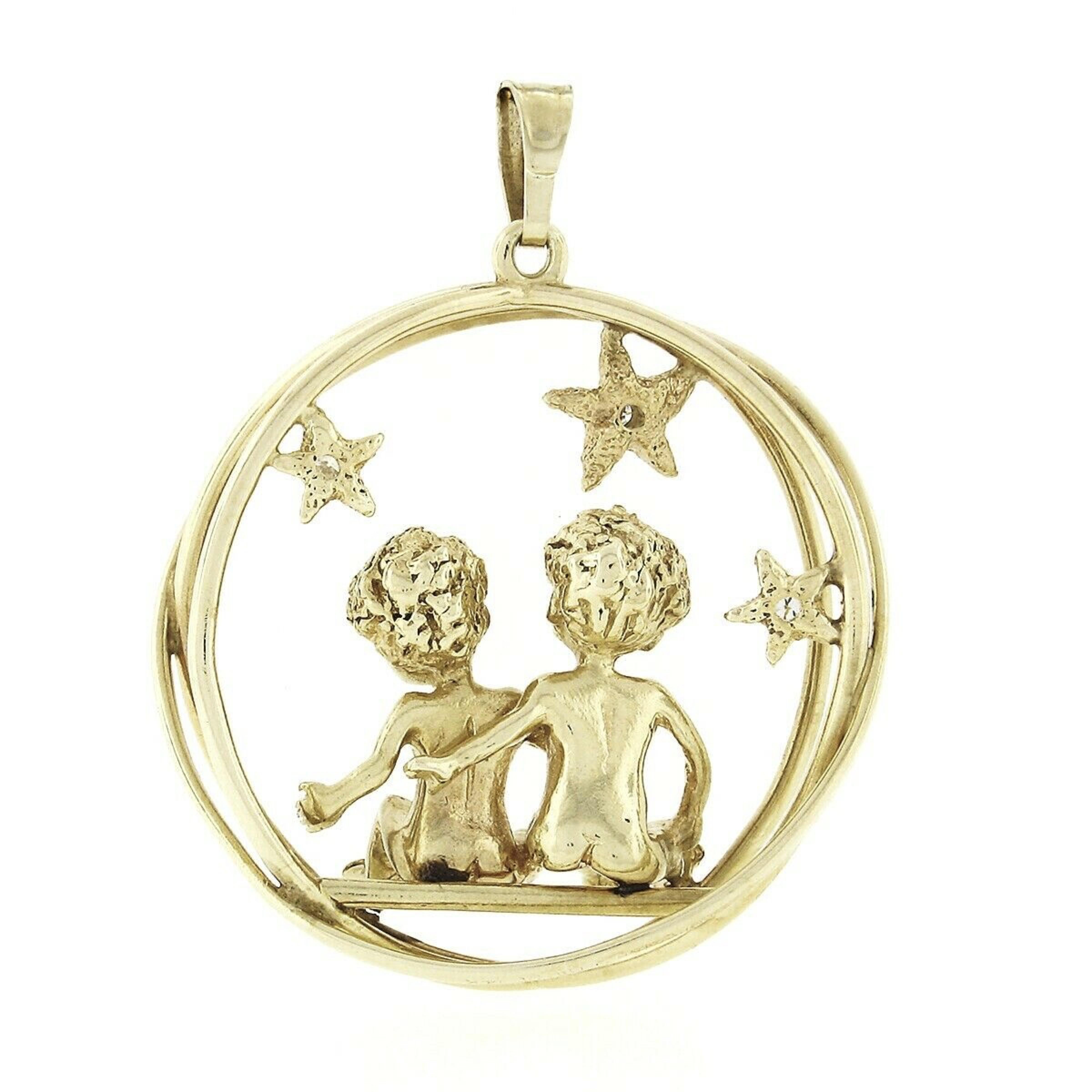 Here we have a large vintage charm/pendant crafted from solid 14 yellow gold and features a 3D scene of two children sitting under the stars in an open circle crossing design. Incredible detail is seen throughout the piece with a nice textured