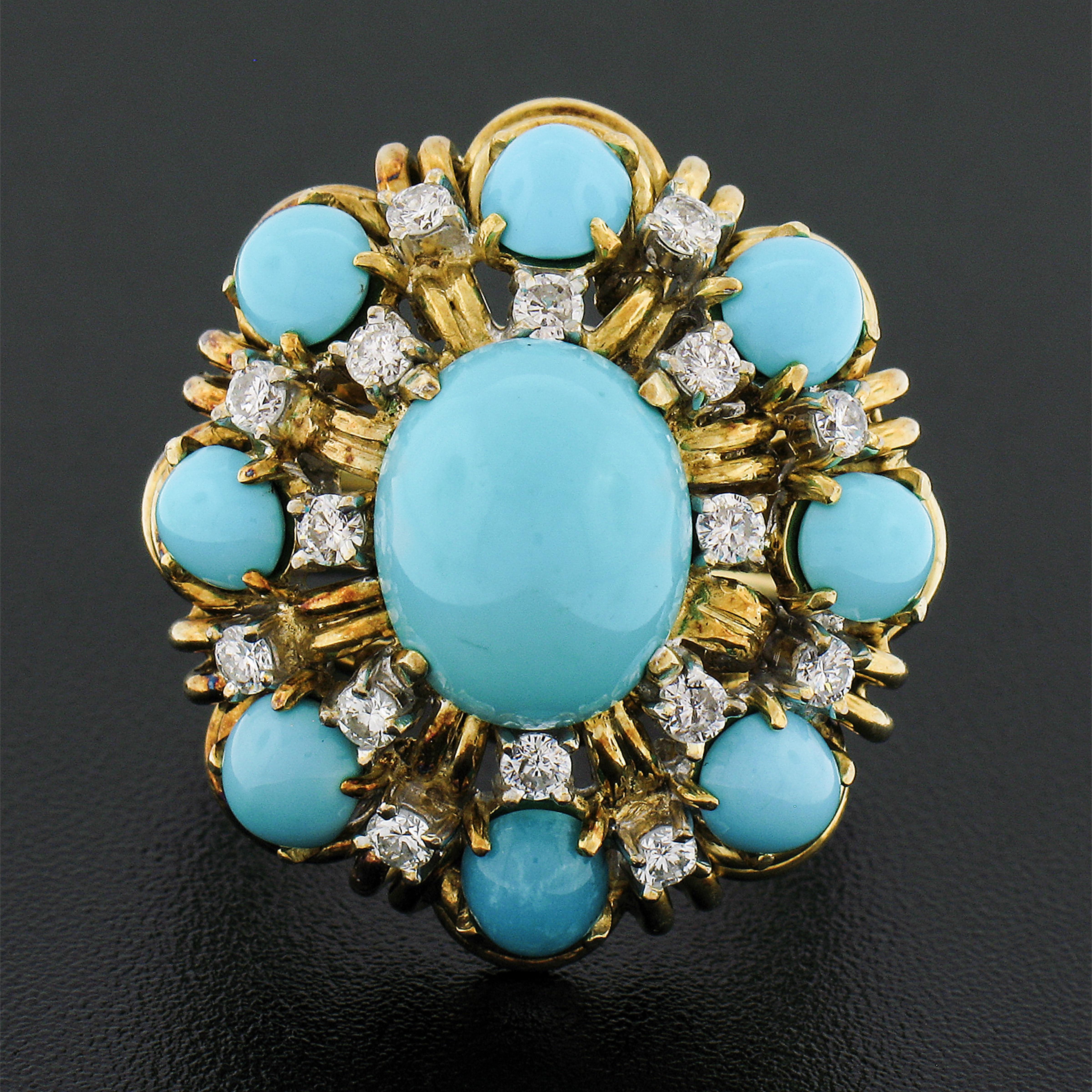 You are looking at a beautiful vintage ring that was crafted from solid 14k yellow gold featuring genuine turquoise stones neatly set throughout an elegant handmade wire work design. A larger oval cabochon cut turquoise is neatly set at the center