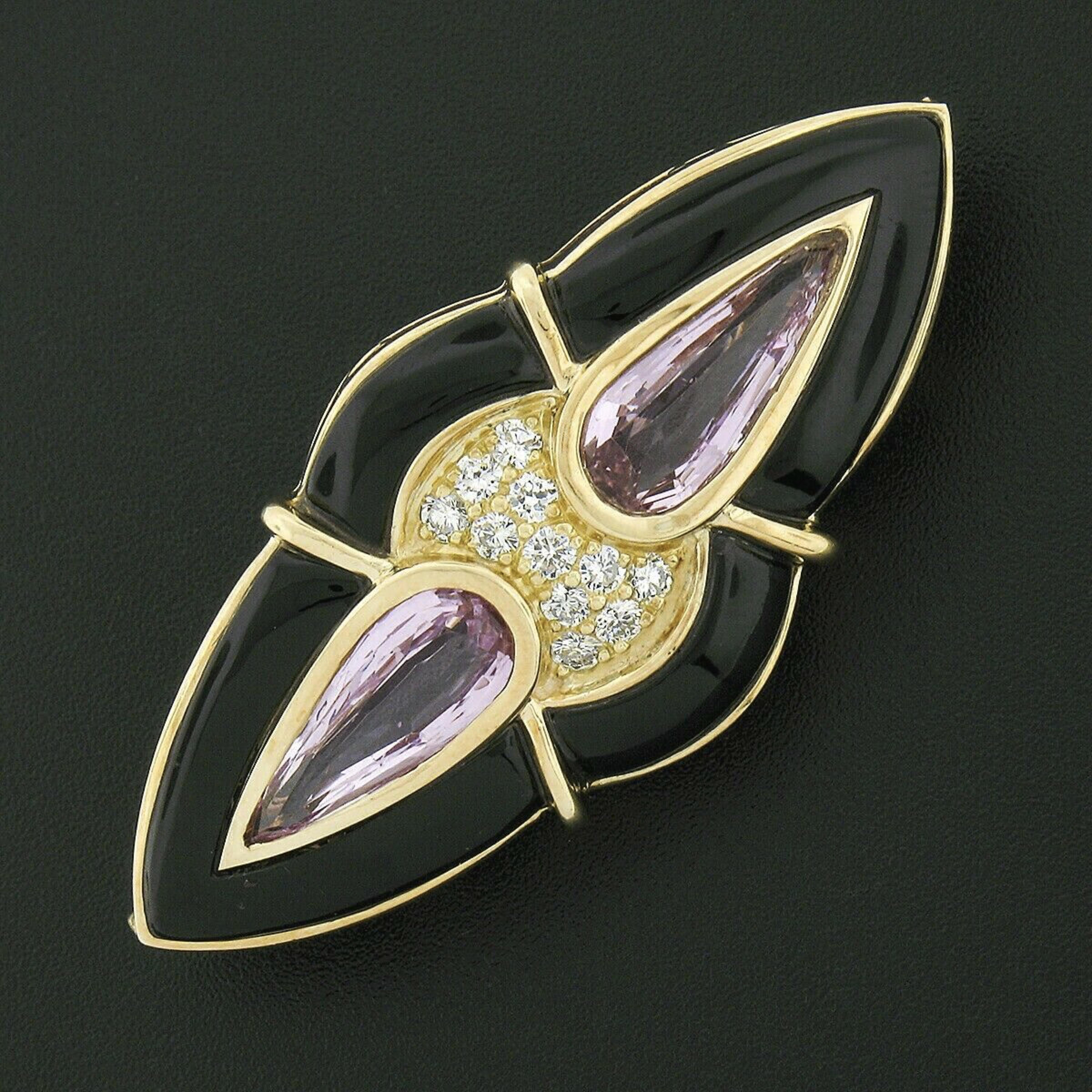 You are looking at a simply marvelous vintage pin brooch crafted from solid 14k yellow gold. It features an elegant design neatly bezel set with two elongated pear pink topaz stones accented with TOP QUALITY diamonds pave set in between the stones