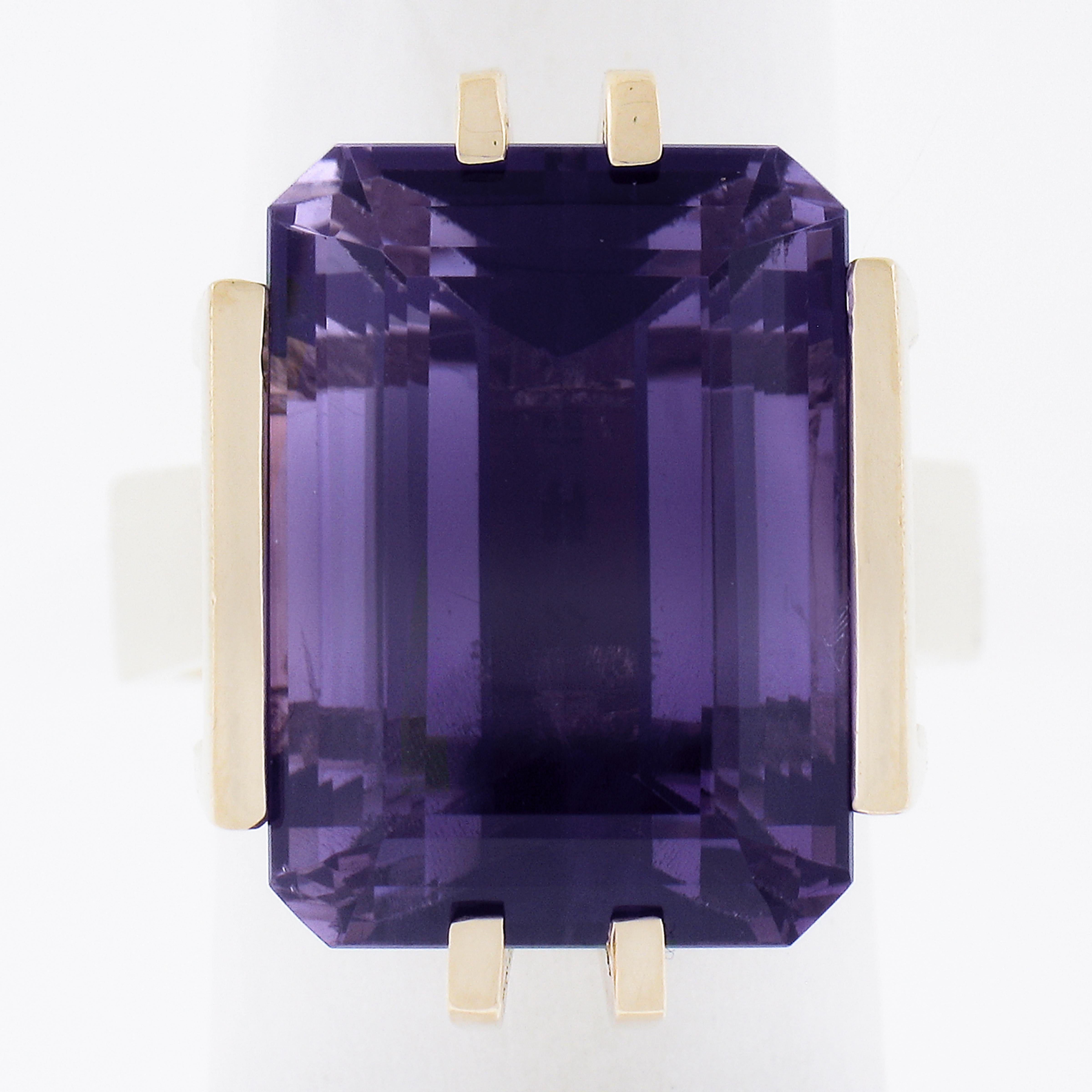 --Stone(s):--
(1) Natural Genuine Amethyst - Emerald Cut - Prong Set - Rich Deep Purple Color - 18x13mm - 18-20ct (approx.)

Material: 14K Solid Yellow Gold
Weight: 13.27 Grams
Ring Size: 5.5 (Fitted on a finger. We can NOT custom size this