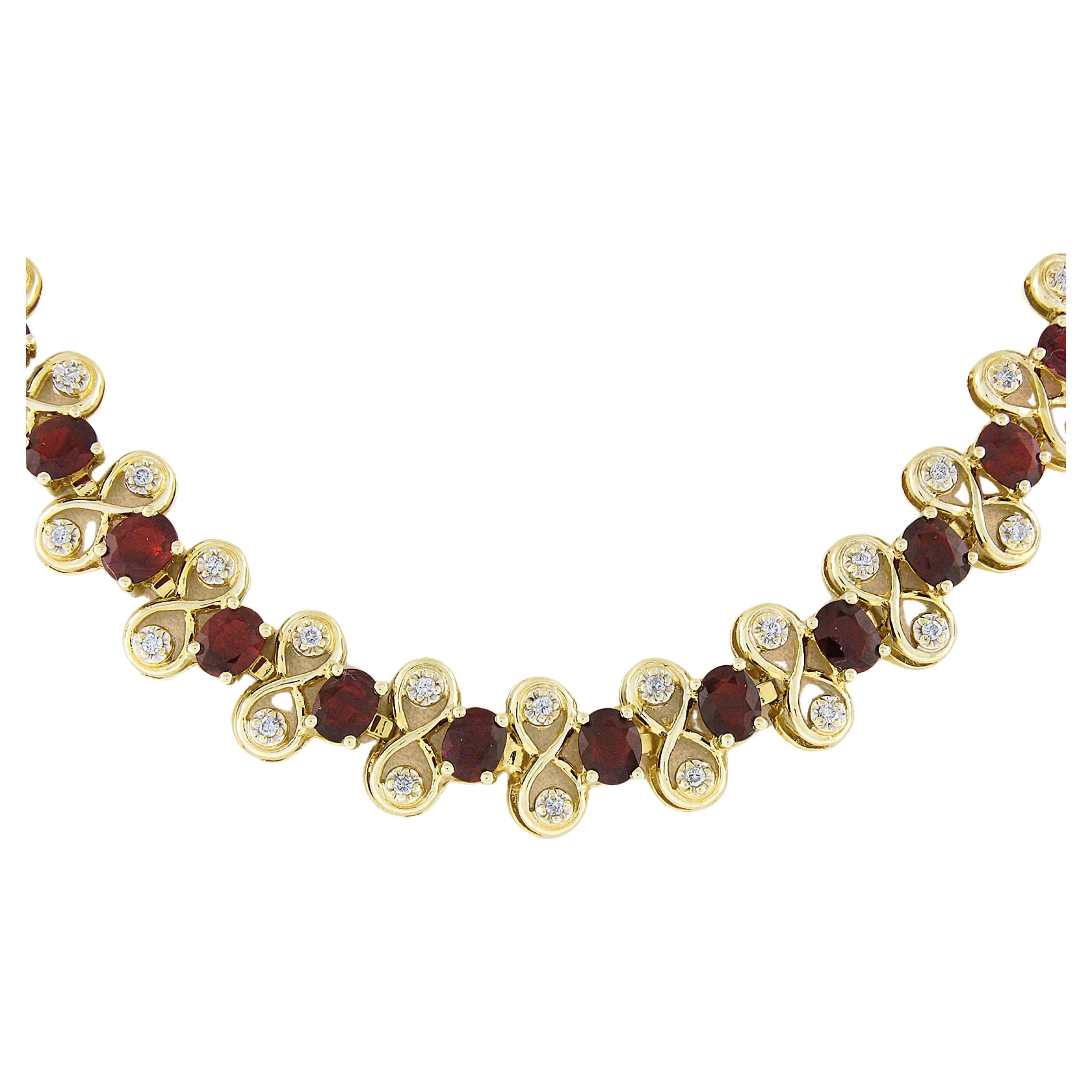 Here we have a gorgeous and well made statement necklace that was crafted from solid 14k yellow gold. The necklace features 51 natural ruby stones that alternate with figure 8 links of which are adorned with fine quality diamonds throughout. Three