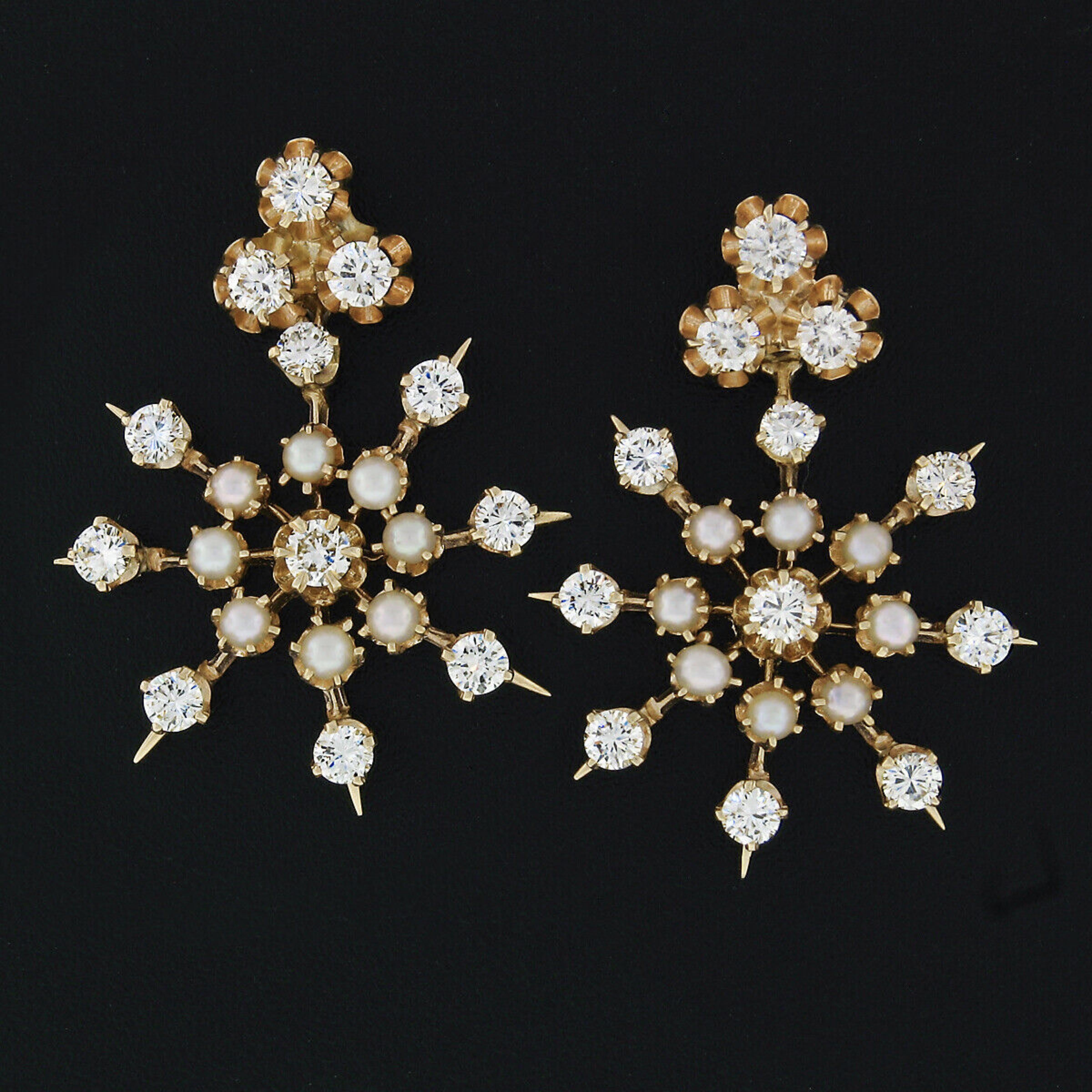 Here we have a beautiful vintage pair of diamond and pearl cluster earrings crafted from solid 14k yellow gold. The earrings feature simple diamond studs constructed from 3 stones each prong set in buttercup-style baskets. Also, from those simple
