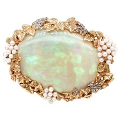 Vintage-Schmuck aus 14-karätigem Gold, 50,40 Karat. Brosche oder Pelzclip mit Opal-Cabochon und Rocailles