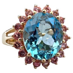 Anello da cocktail vintage in oro 14 carati con topazio blu ovale da 6,00 carati e zaffiro rosa con montatura a halo