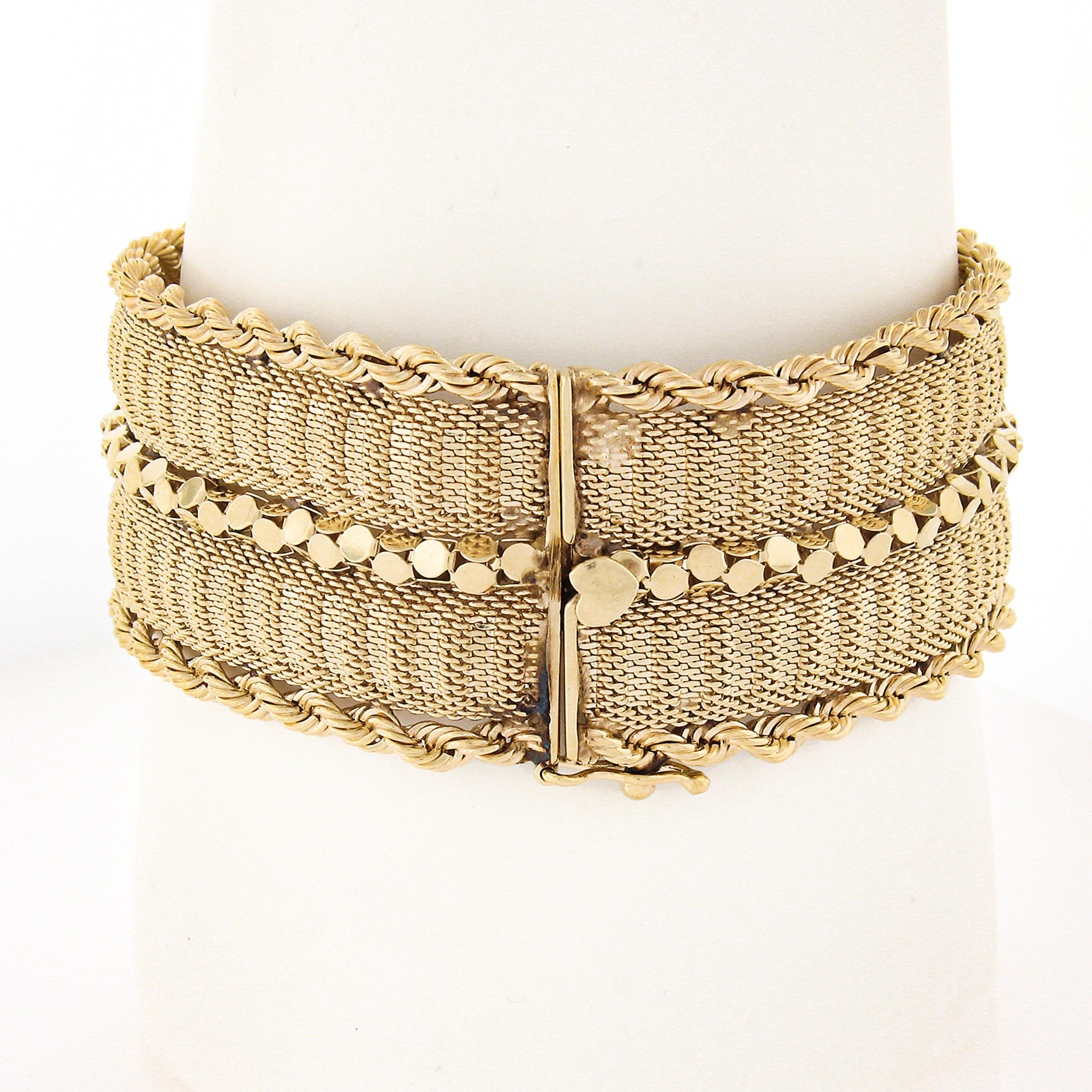 You are looking at a gorgeous and well made vintage bracelet that was crafted from solid 14k yellow gold. This unique wide strap bracelet is constructed from mesh link with high polished popcorn links that run through the center, and further