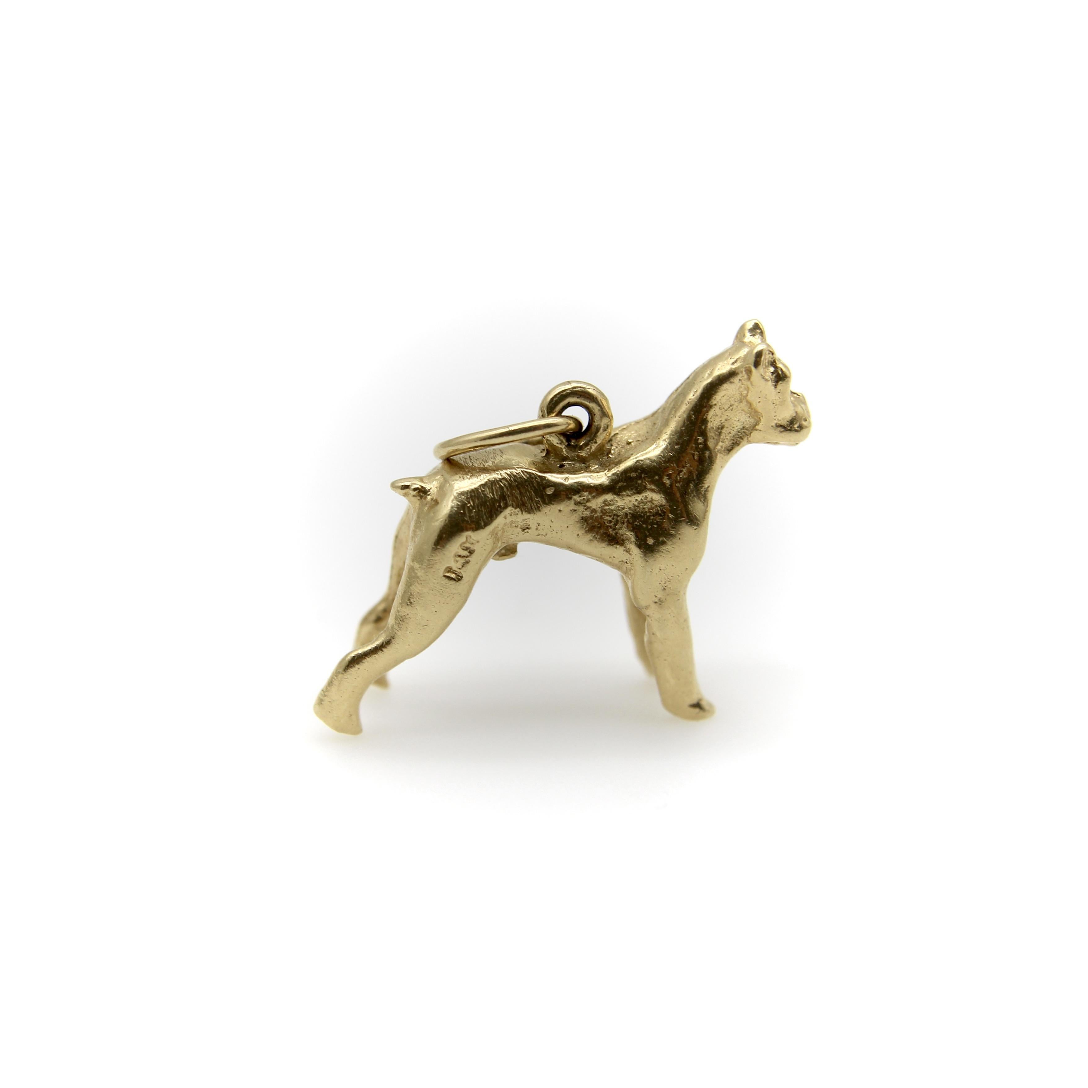 This is the perfect charm for any dog lover—especially for anyone with a pet boxer! This 14k gold charm is a lifelike rendering of a standing boxer dog in a great realistic pose with articulated details. The adorable dog seems ready for