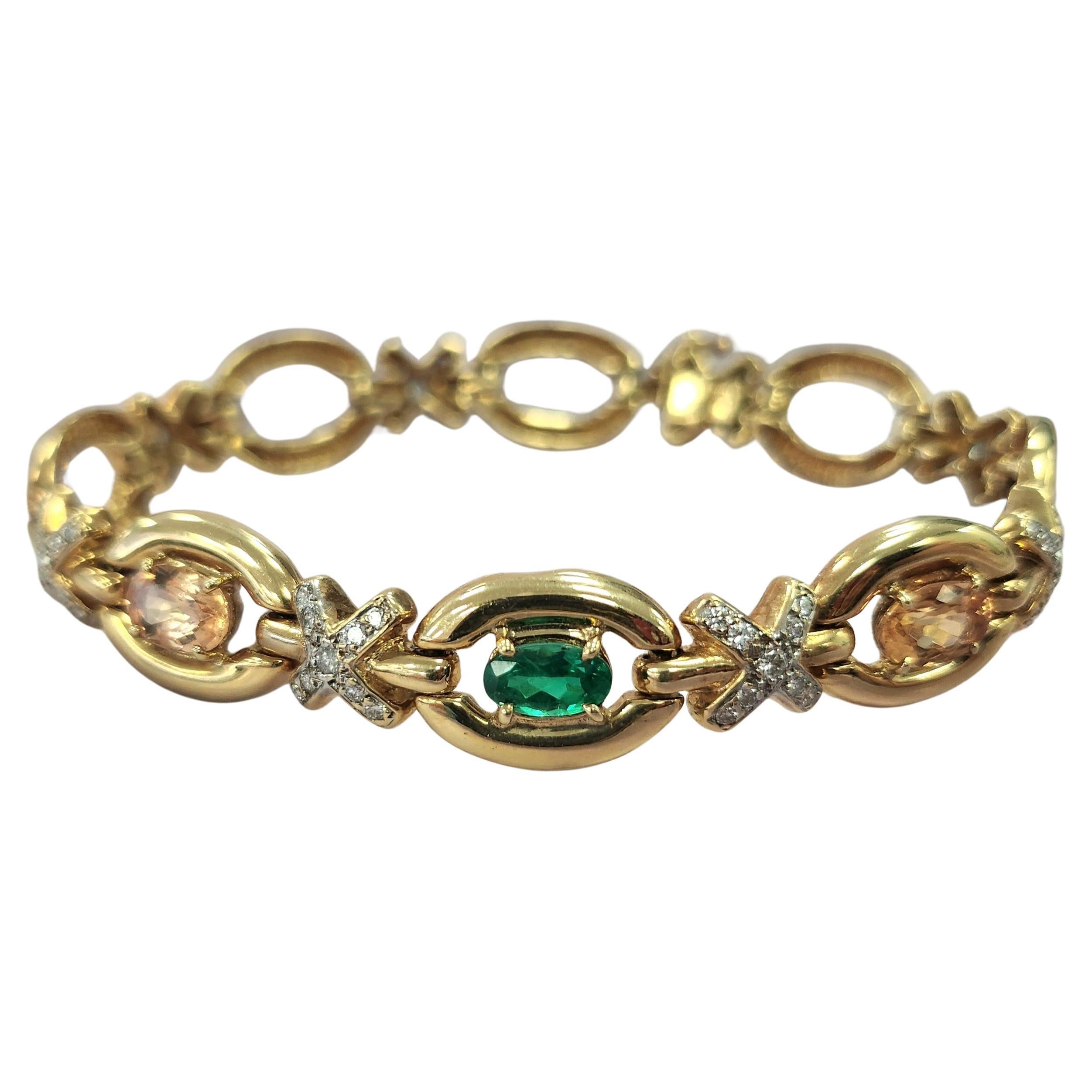 Vintage 14K Gold Bracelet with Emerald, Imperial Topaz & Diamond Accents
Add a touch of timeless elegance to your collection with this stunning vintage 14K gold bracelet, featuring a captivating blend of color and brilliance.

✨ Details:

Weight: