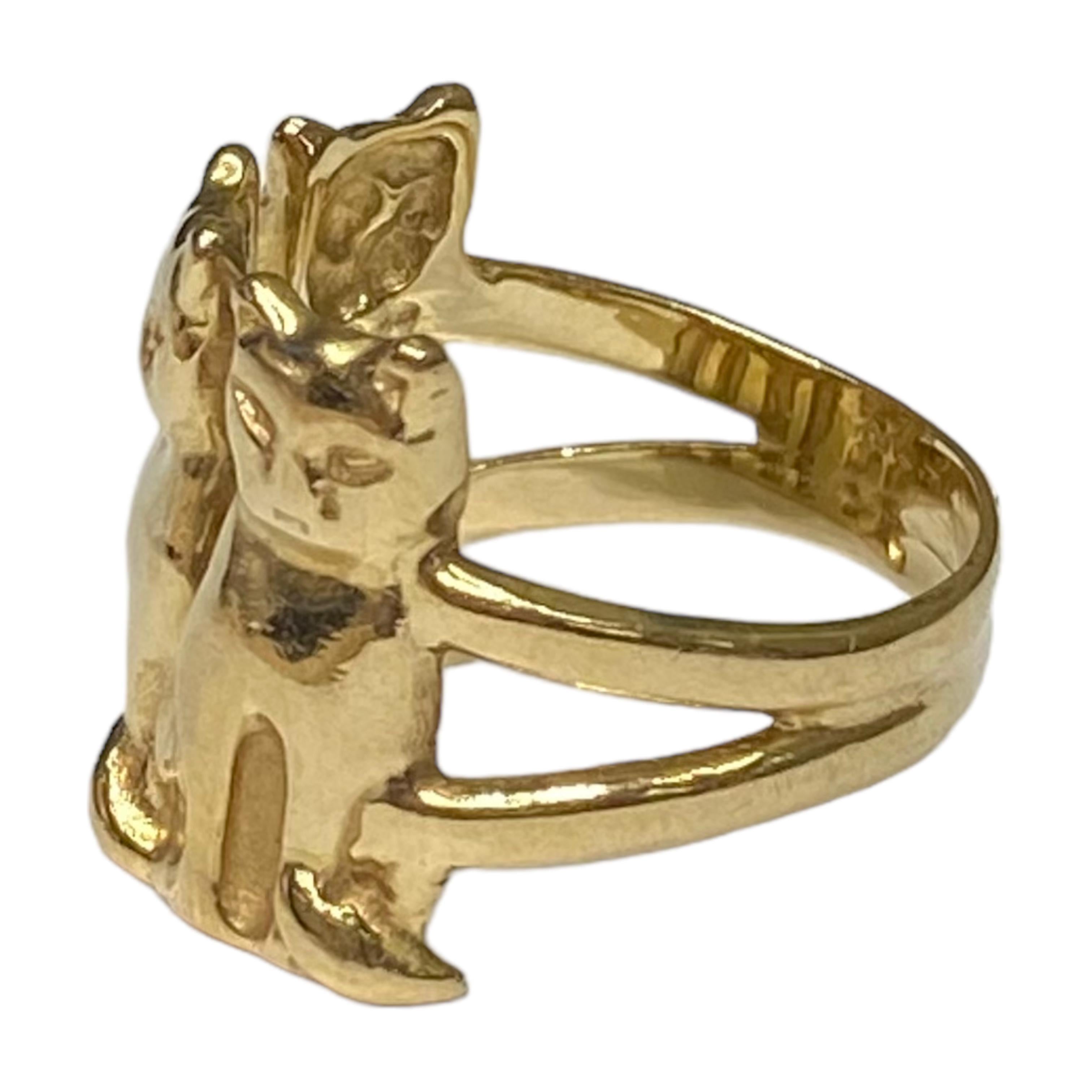 Crafted in 14K yellow gold, the ring features three sitting cats on the front.
Measurements:
Width: 16.6 mm (front) - 4 mm (back)
Weight: 7 grams
Size: 7 (sizable)
Marked: ARDIAN (The stamp partially faded, but still visible.)