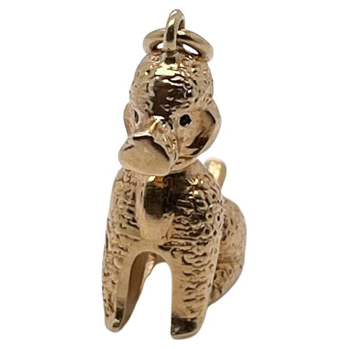 A vintage 14 karat gold charm for a charm bracelet. 

In the form of a French poodle.

A rare and terrific charm!

Date:
Mid-20th Century

Overall Condition:
It is in overall good, as-pictured, used estate condition with some very fine & light