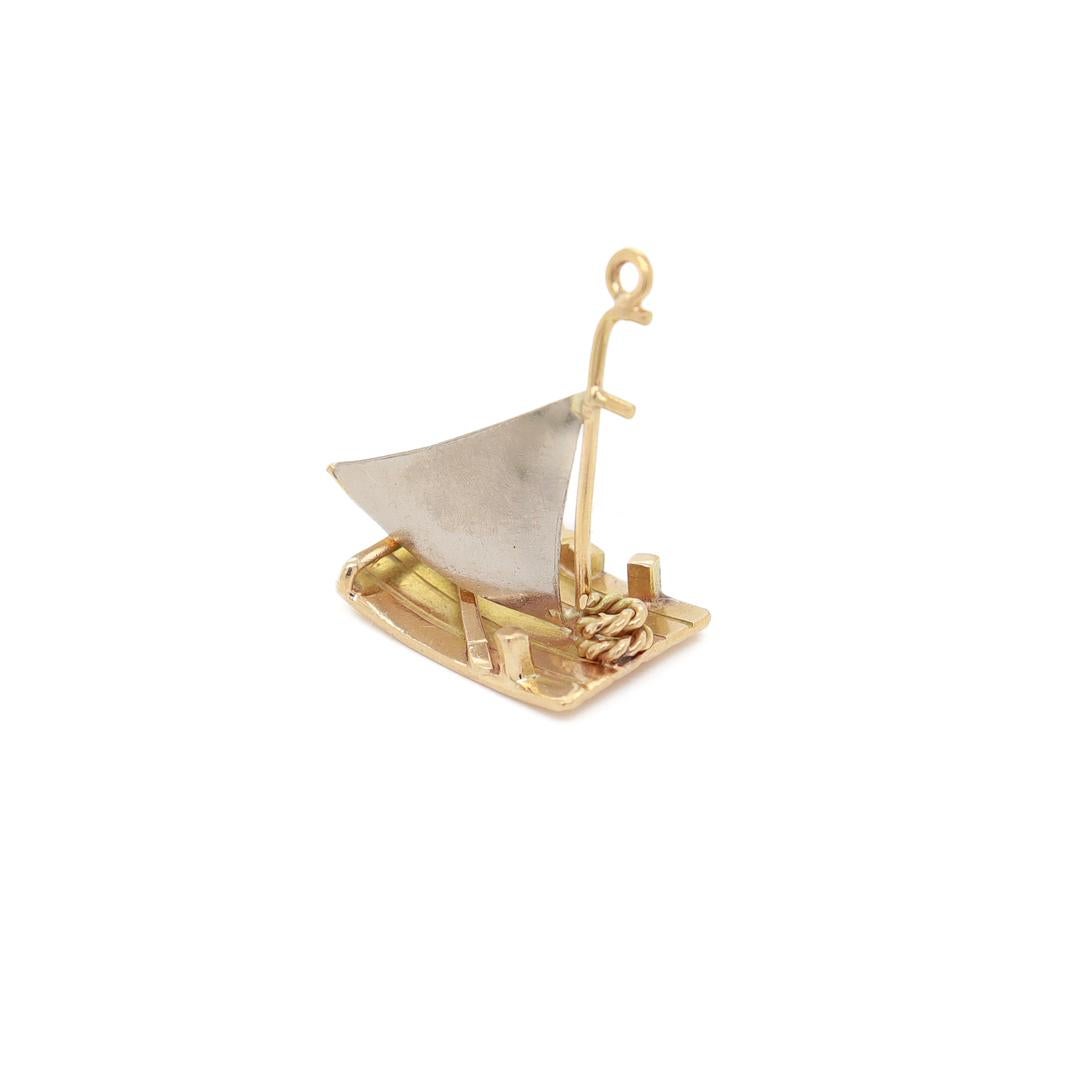A fine vintage charm.

In 14k yellow gold.

In the form of a raft or sailboat.

Simply a wonderful charm!

Date:
20th Century

Overall Condition:
It is in overall good, as-pictured, used estate condition. There is some light edge wear, some fine and