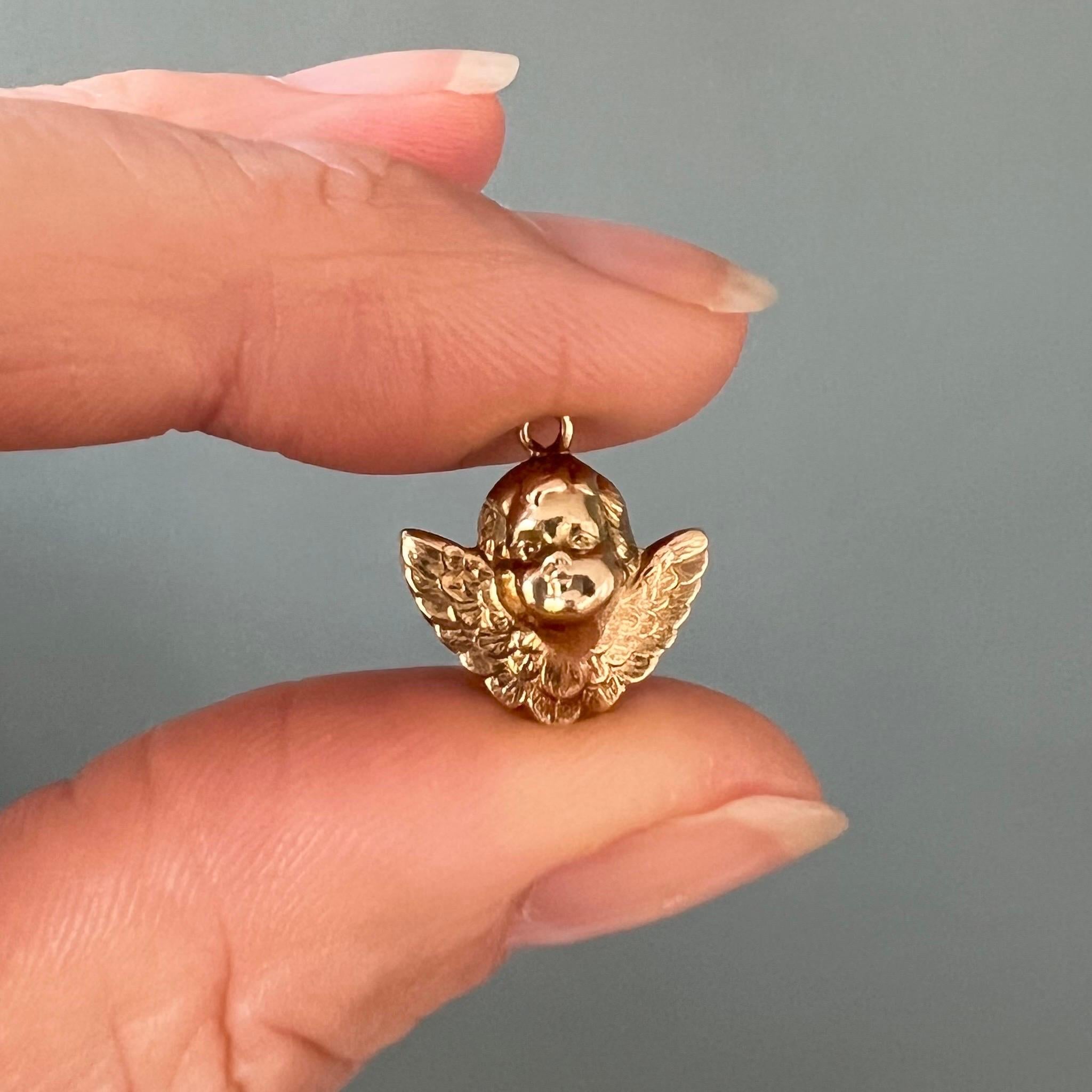 This is a vintage 14 karat yellow gold cherub charm pendant. The winged angelic being is beautifully detailed with its lovely baby angels face and finely detailed wings.

Collect your own charms as wearable memories, it has a symbolic and often a