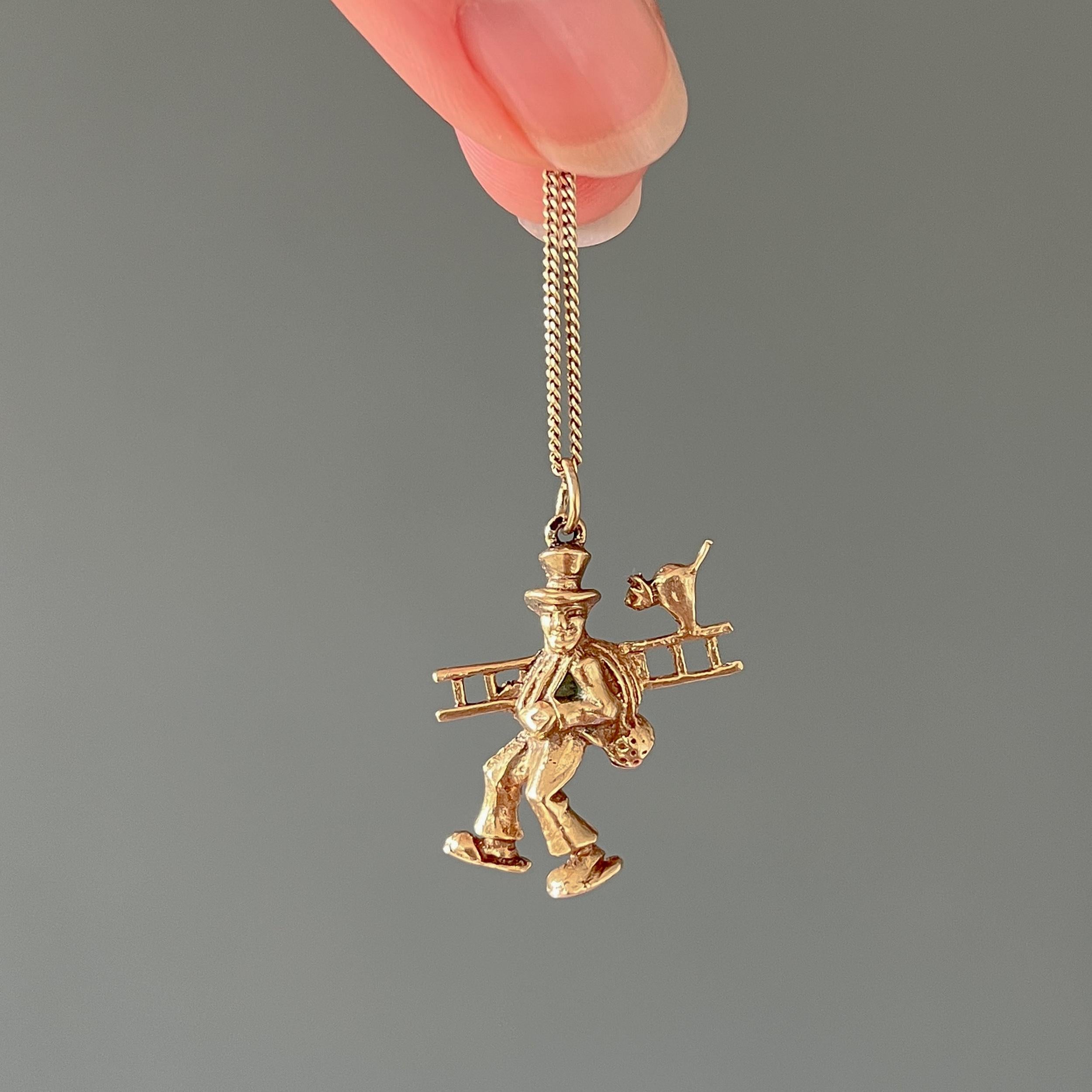 A vintage 14 karat yellow gold chimney sweep and cat charm pendant. The charm is nicely detailed with the chimney sweep, his gear and the lovely cat who hitches a ride on top of the ladder. This chimney sweep is ready to clear some soot!

In the