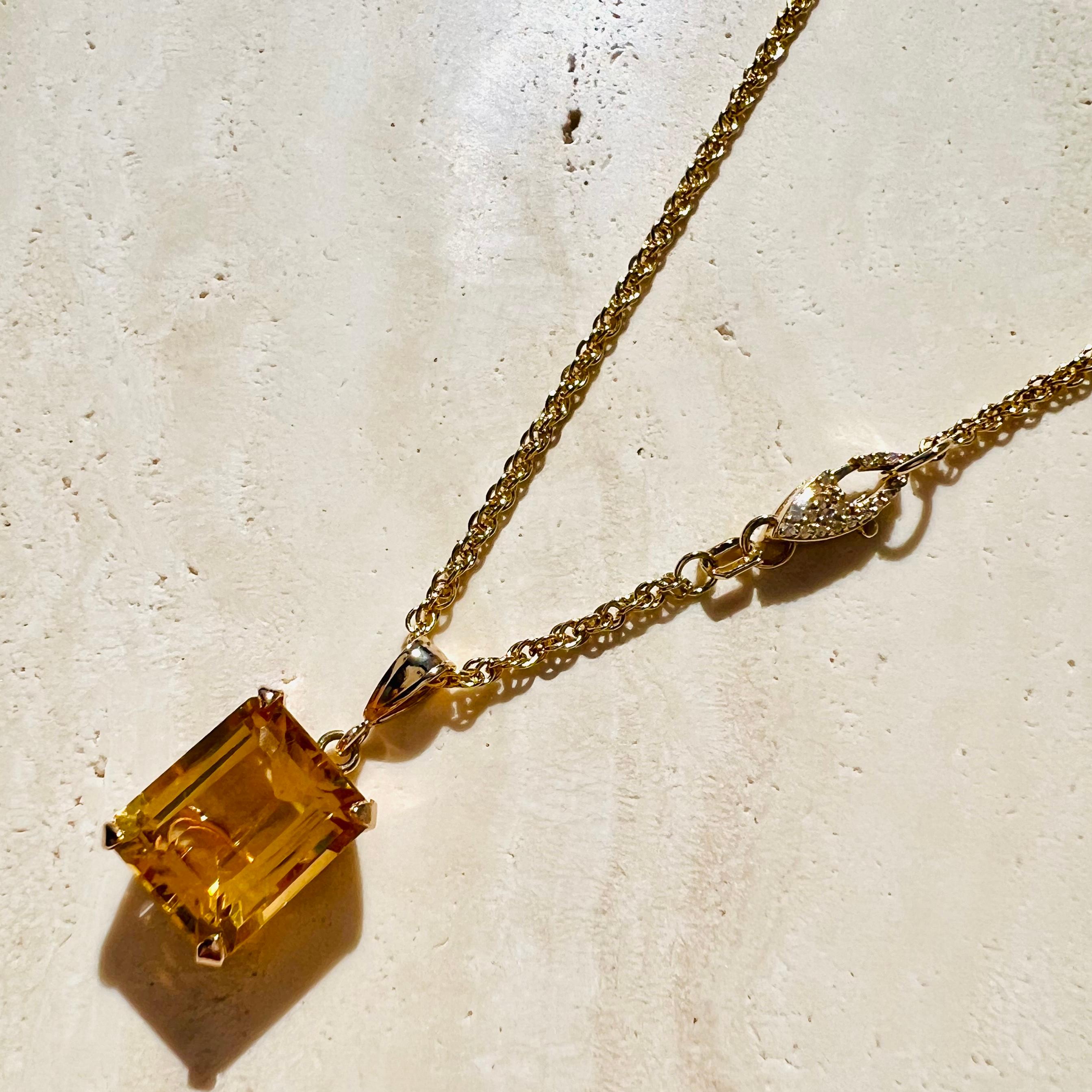 A 14k gold citrine pendant paired with a custom pavé double-sided diamond clasp and solid 14k gold overlapping chain. Can be styled with the diamond clasp in the front or back. No need to constantly readjust the clasp of a plain gold chain out of