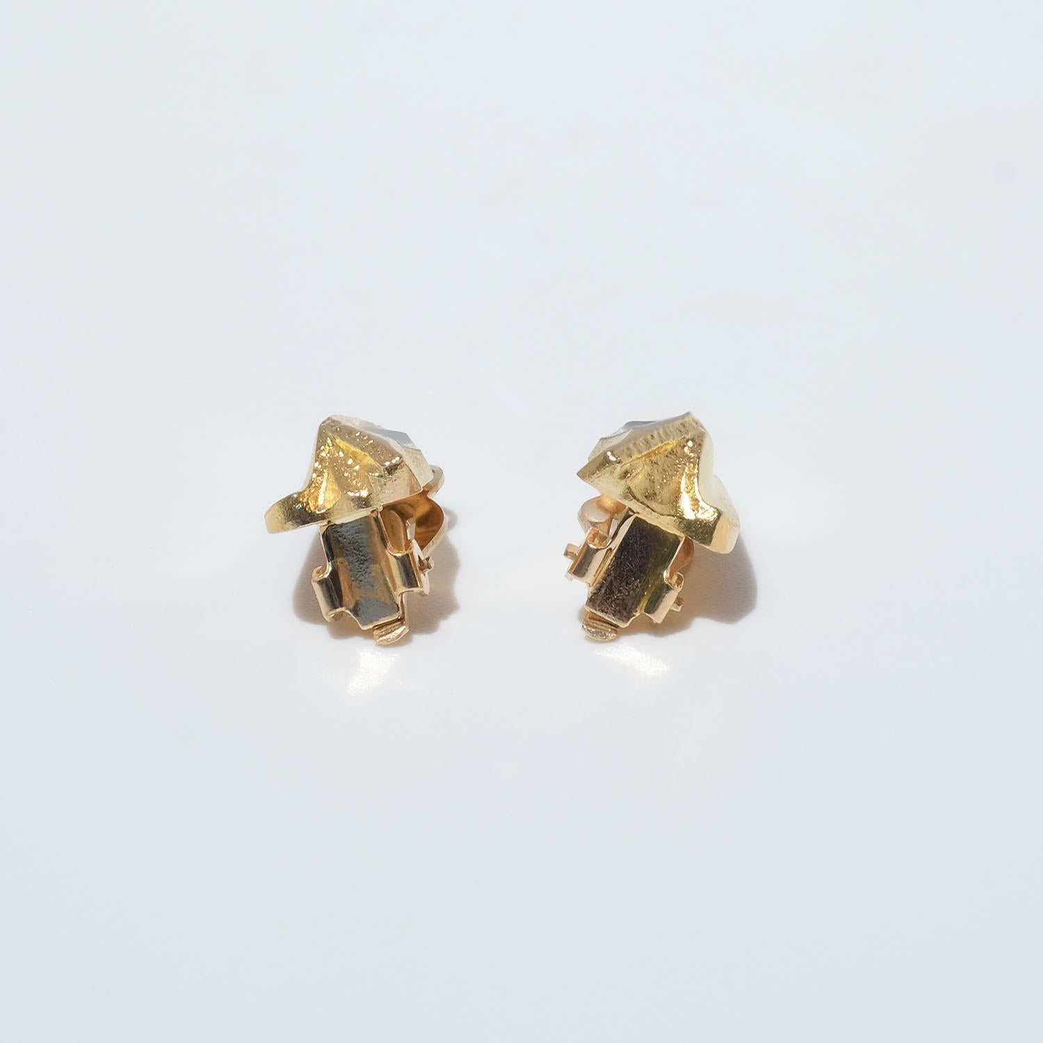 These 14 karat two-toned gold clip-on earrings are called (