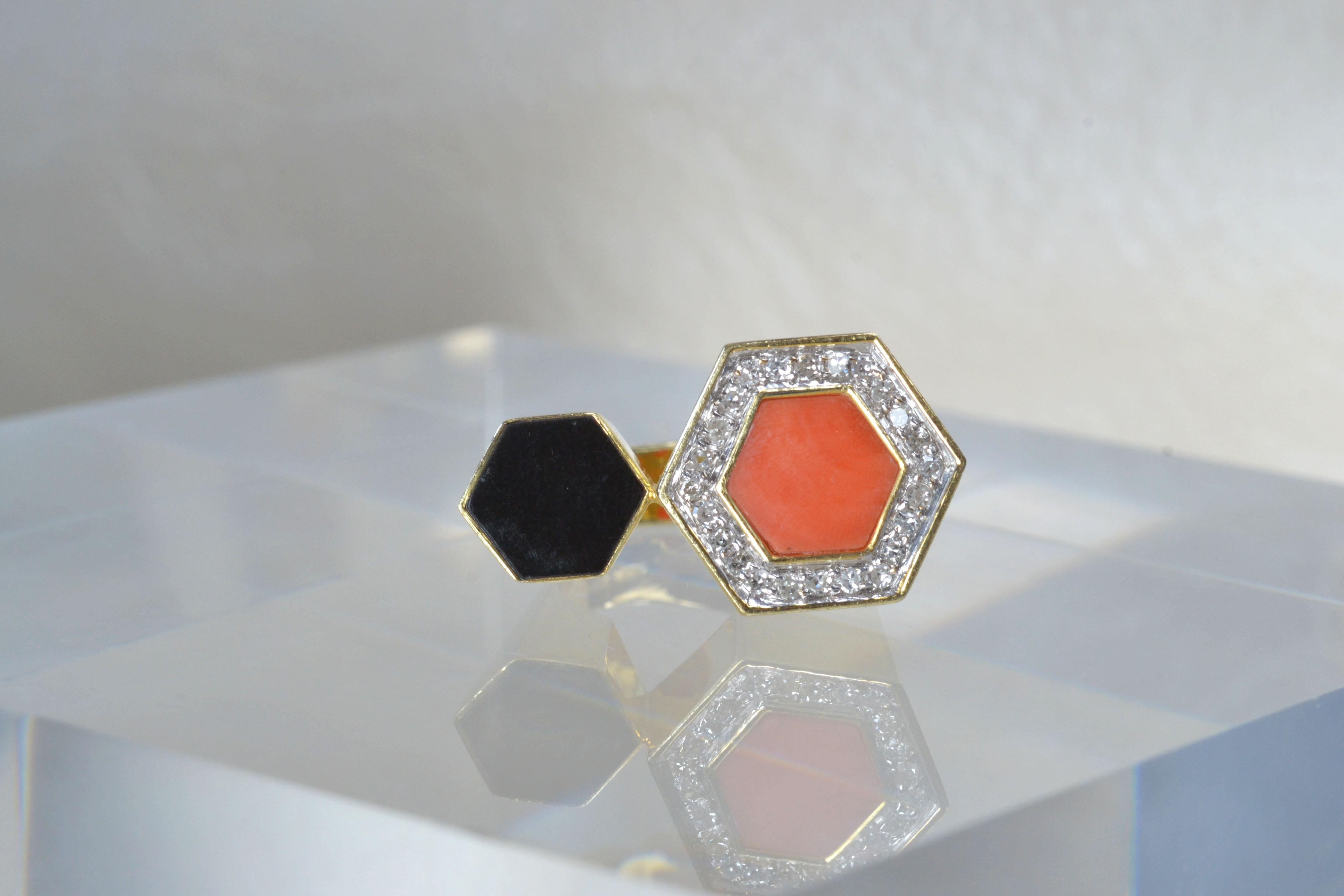 Vintage 14k Gold Coral & Onyx Ring with Diamond One-of-a-kind

This cool 14k gold ring features hexagons made of gorgeous coral encased in dazzling white diamonds and jet-black onyx. Made in the 1980s, this statement piece comfortably fits a size R