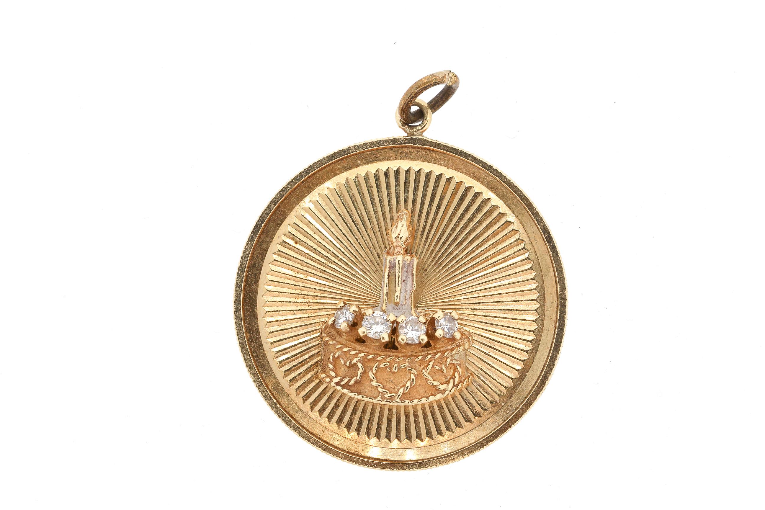 A large 14k yellow gold round disc charm with a birthday cake set with 4 diamonds, circa 1960. The charm features a dimensional birthday cake with hearts and diamonds set on a fluted gold background. The charm has a coin edge finish. The charm is