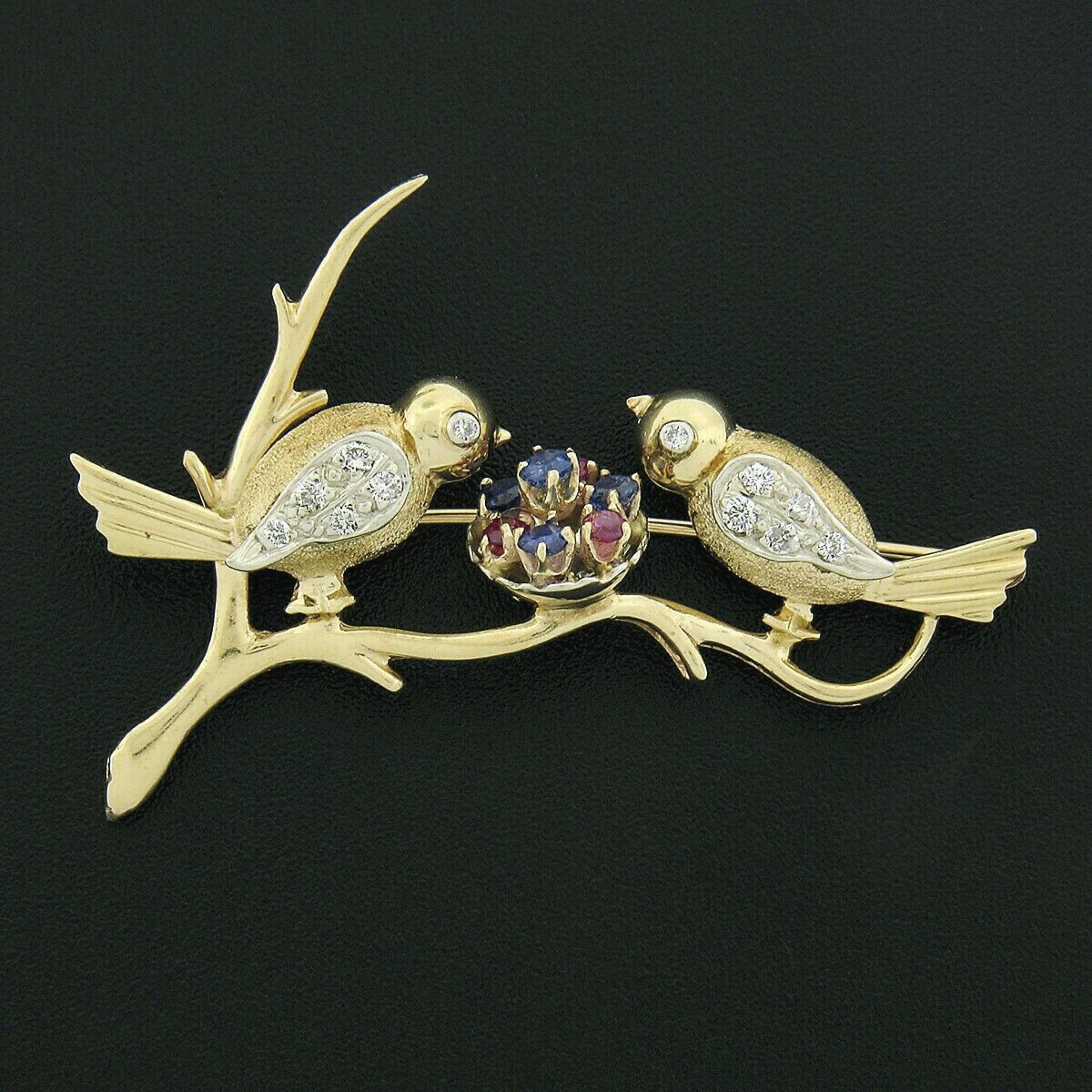 Here we have a gorgeous vintage brooch that is crafted from solid 14k yellow gold with white gold accents featuring a super sweet love birds design set with fine quality stones throughout. The two love birds are perched on a high-polished branch and