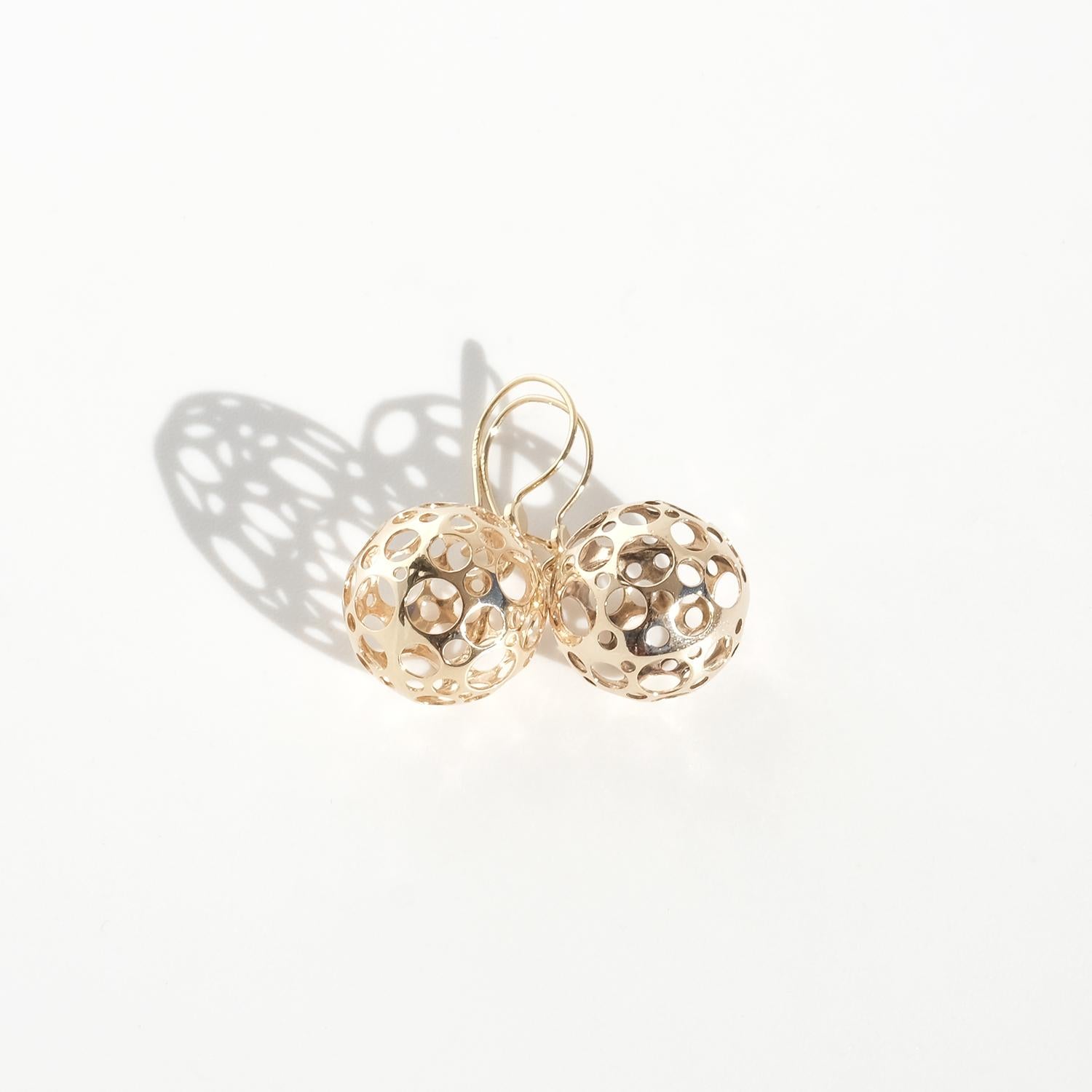 These vintage gold earrings are part of Liisa Vitali's renowned 