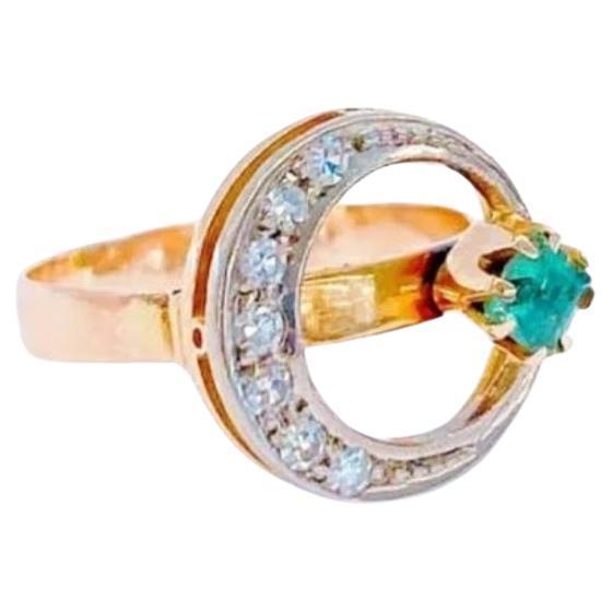 Vintage 14k gold ring in crescent designe yellow gold topped with white gold and brilliant cut diamonds estimate weight of 0.50 carats centered with green natural emerald ring is hall marked 583 and assay mark M for moscow 1940.c and inital maker