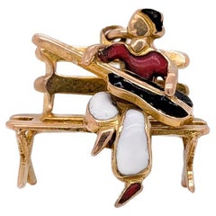 Vintage 14K Gold & Enamel Figural Guitarist on Bench