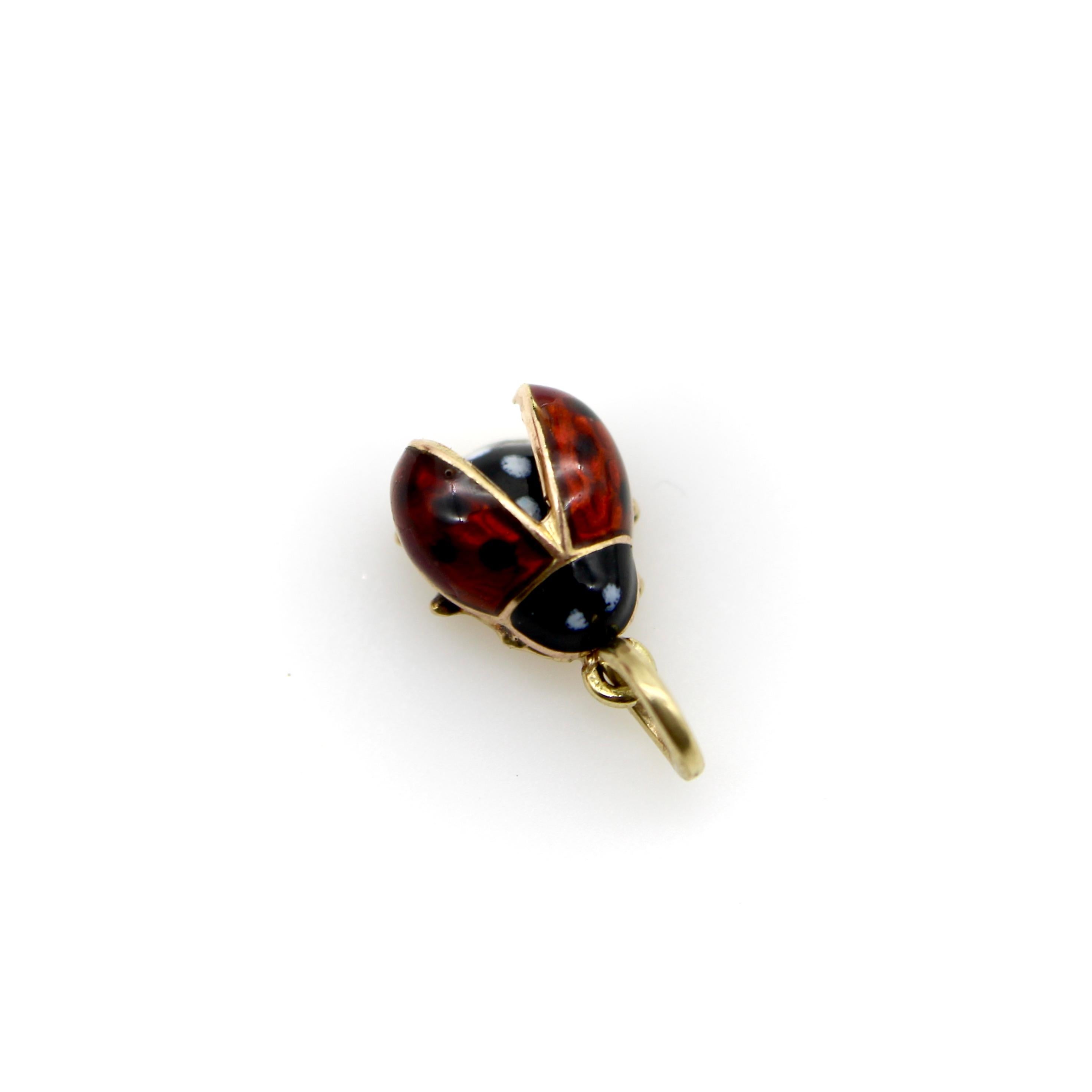 This 14k gold enamel ladybug charm is perched and ready to take off into flight. Its red enamel wings—dotted with adorable black spots—are lifted to reveal its black and white polka dotted body. The black enamel head has two tiny white eyes that