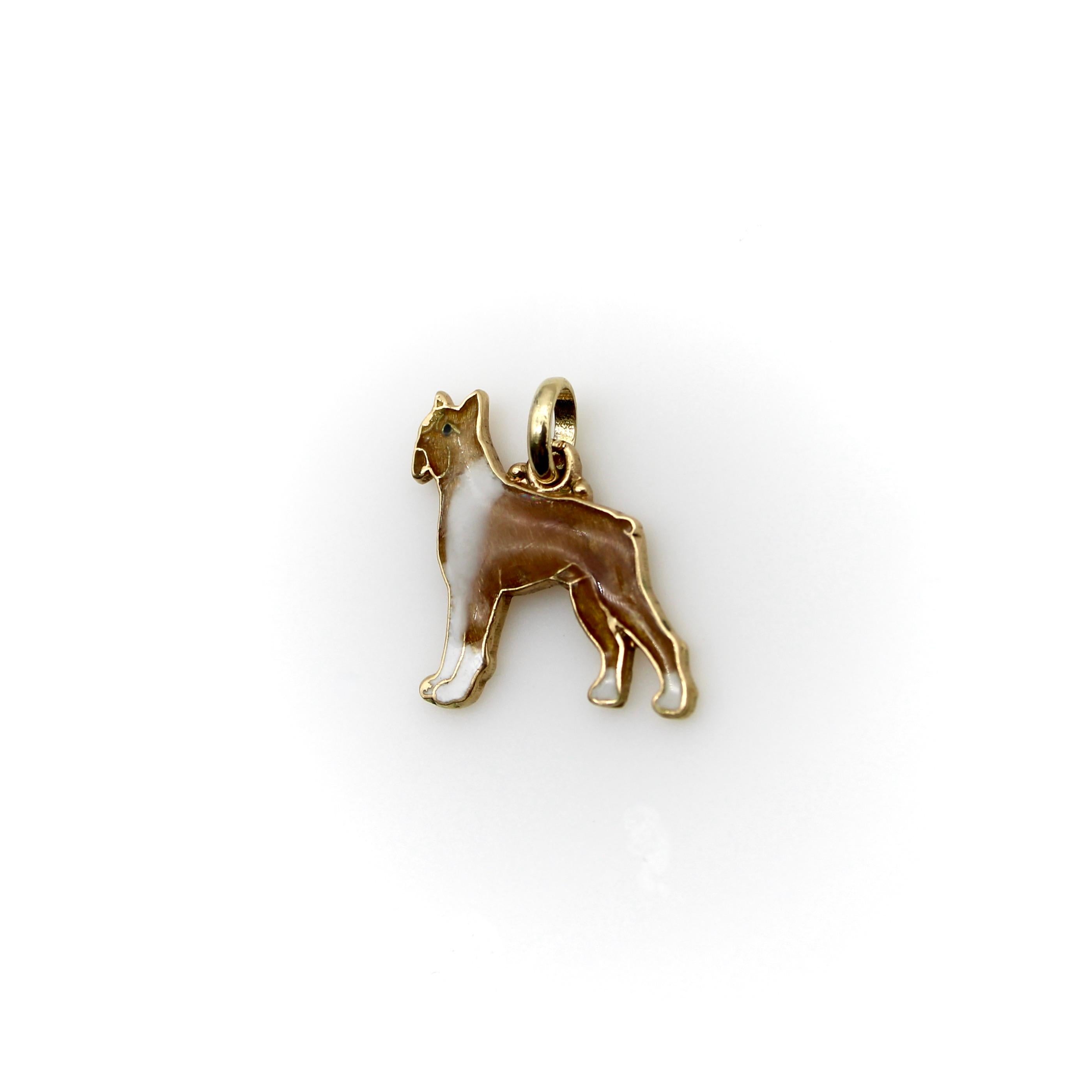Made in 14k gold with enamel details, the dog in this charm is a boxer with a tan body and white chest and paws. In the 1950’s, the boxer was the most popular dog in America, and this proud little dog is a great representation of the breed. Each