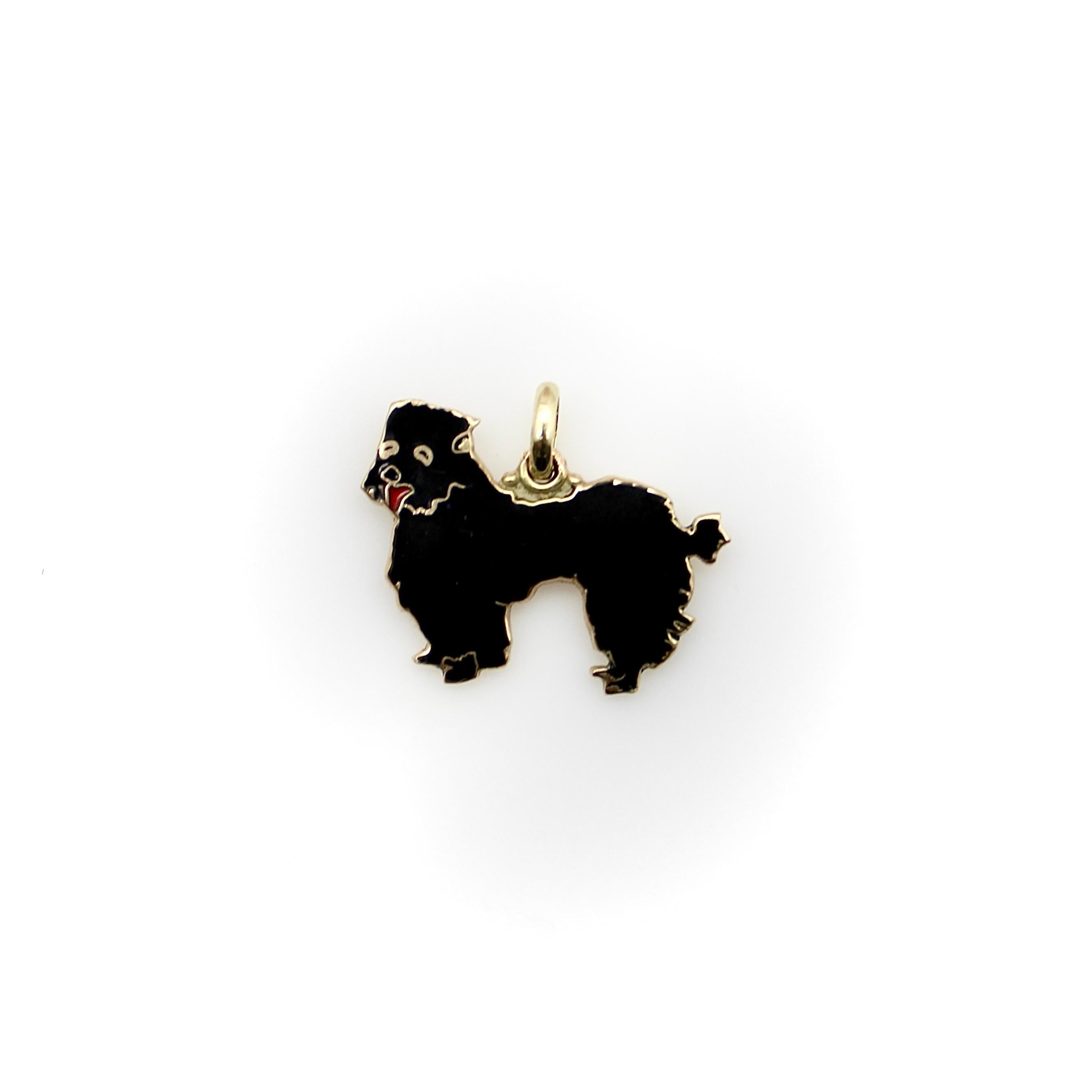 Made in 14k gold with enamel details, the poodle in this charm has a fluffy outline of black hair, and the red highlight for its panting tongue gives the dog a cute facial expression. Circa the 1960’s, the adorable dogs in these charms captured our