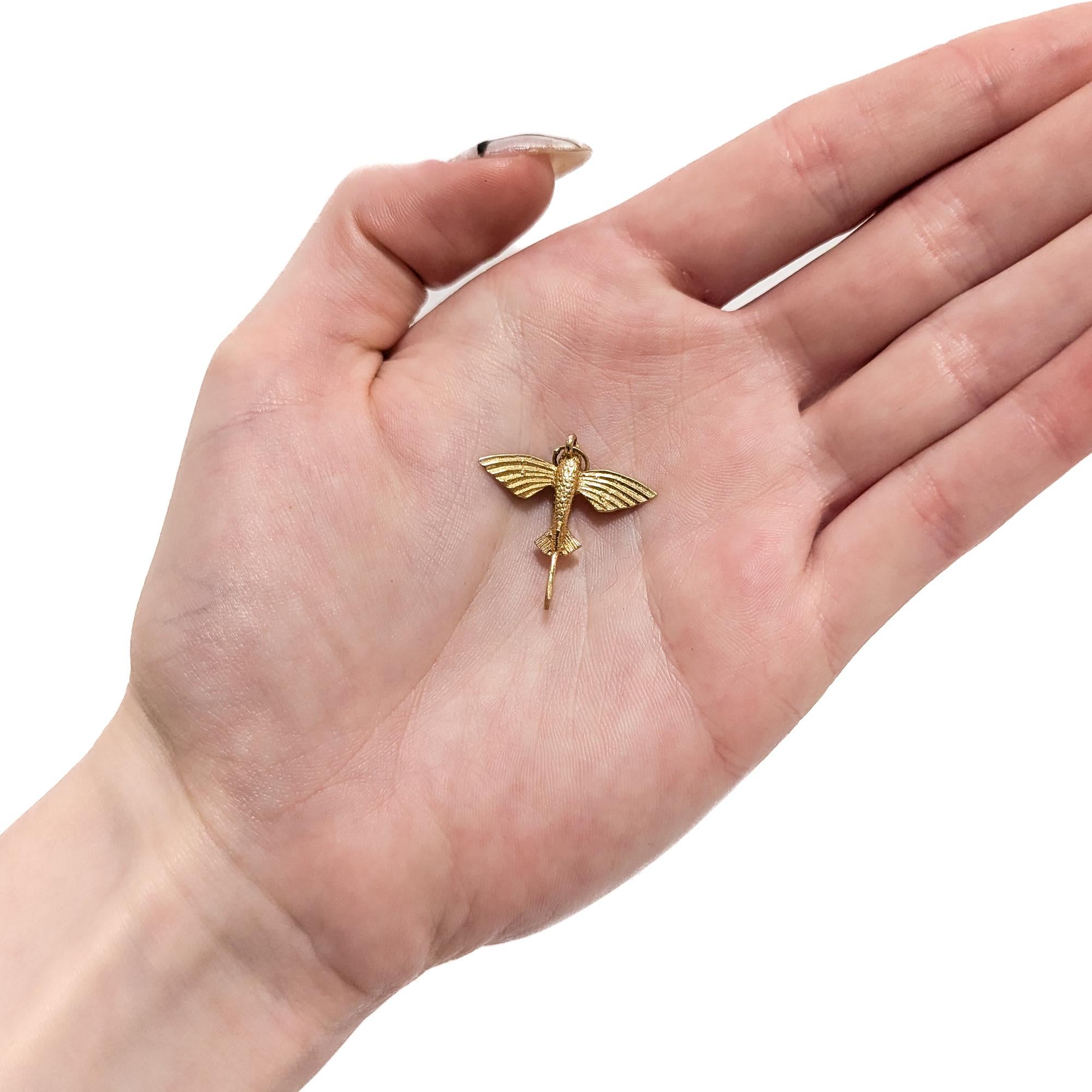 Une breloque en or d'époque.

En or jaune 14 carats.

Sous la forme d'un 