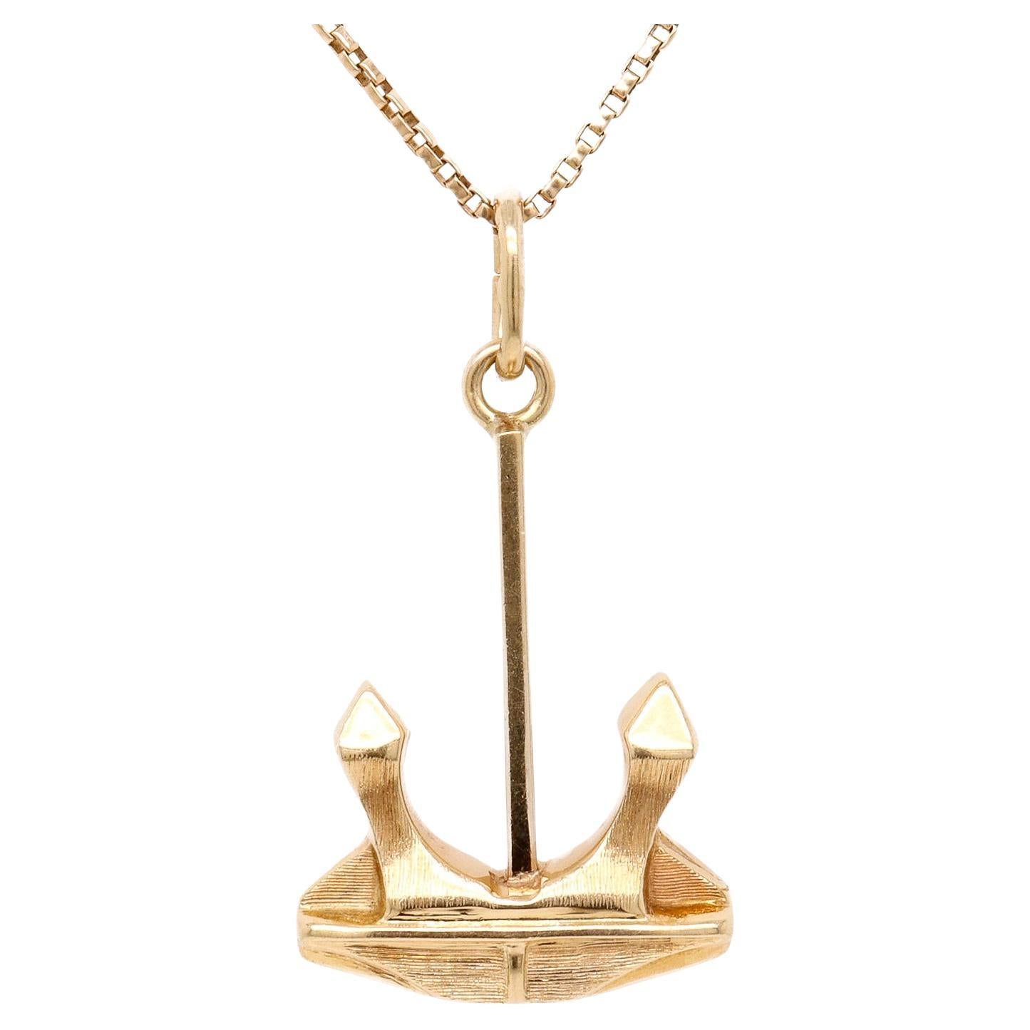 Ciondolo o charm in oro 14K con ancora industriale figurativa d
epoca