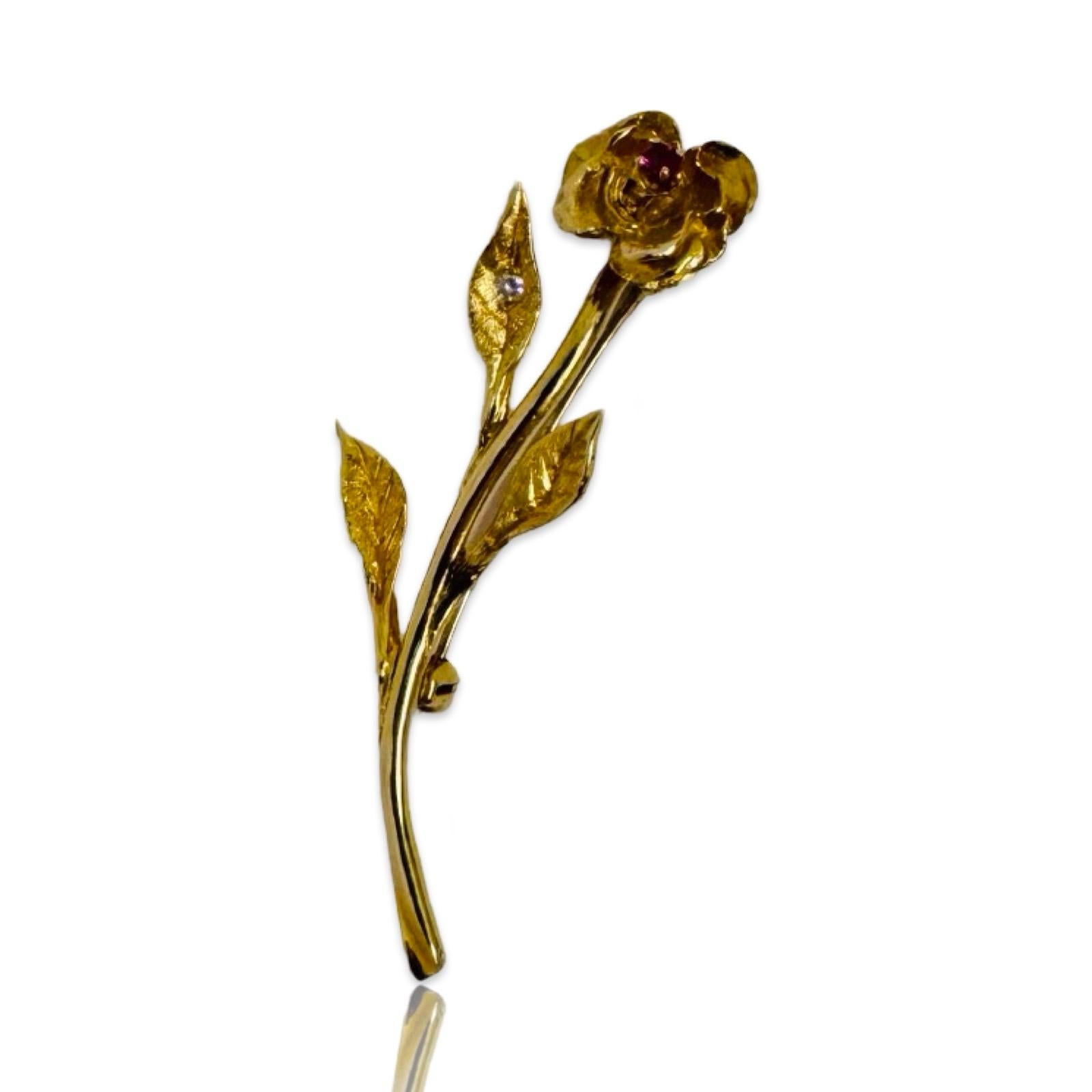 An embodiment of timeless elegance and masterful craftsmanship, this exceptional vintage brooch is meticulously fashioned in solid 14K yellow gold, weighing 5.3 grams. The sculptural floral design captures the delicate beauty of nature with lifelike