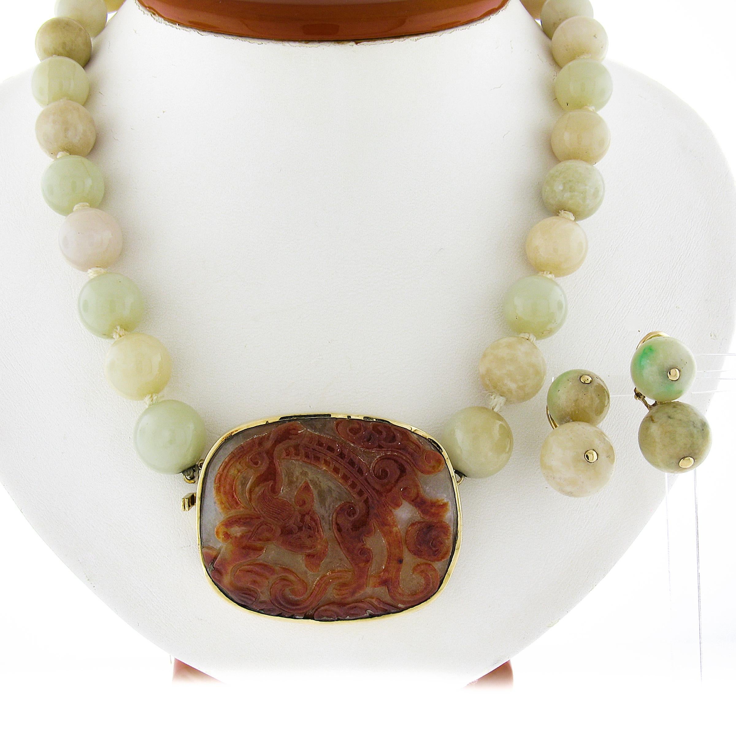 --Item Details (Necklace):--
--Stone(s):--
(1) Natural Jade - Carved Custom Cut - Bezel Set - Greenish Gray with Brown Carving - 47.41x38.05mm (Certified) ** See Certification Details Below for Complete Info **
(30) Natural Jade - Bead Ball Shape -