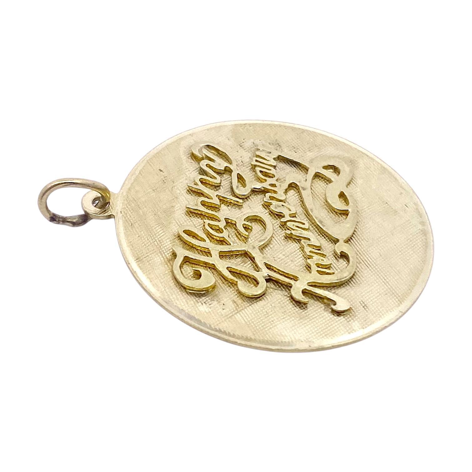 Crafted in 14K yellow gold, this pendant features a 