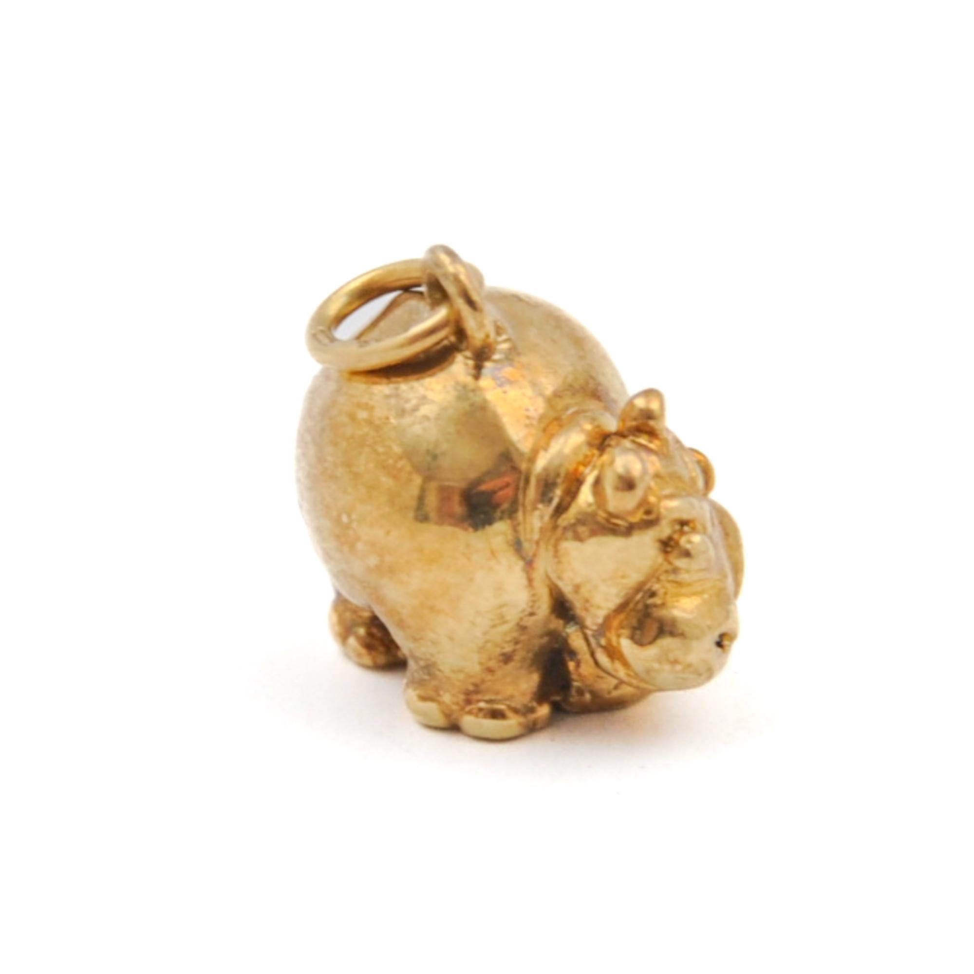 A rare vintage stylized and detailed hippo charm pendant. This animal has a real authentic hippo expression with its detailed head and firm body. This fearless creature is made in 14 karat gold.

The hippo is in very good condition and of high