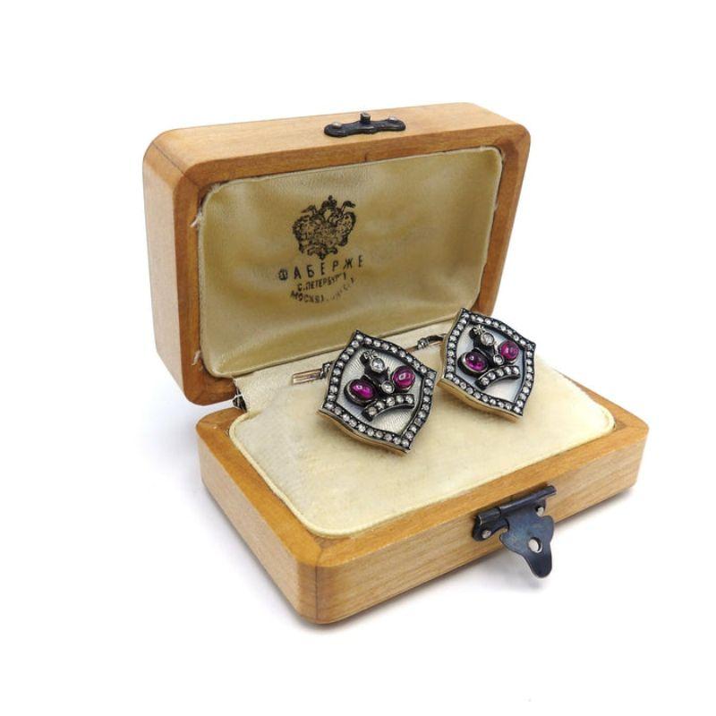 This stunning pair of Russian cufflinks are made in the Imperial Style of Czarist Russia. They are 14k rose gold with sterling silver fronts; that are embellished with a border of diamonds. In the center is the Imperialist Crown of Russia, made of