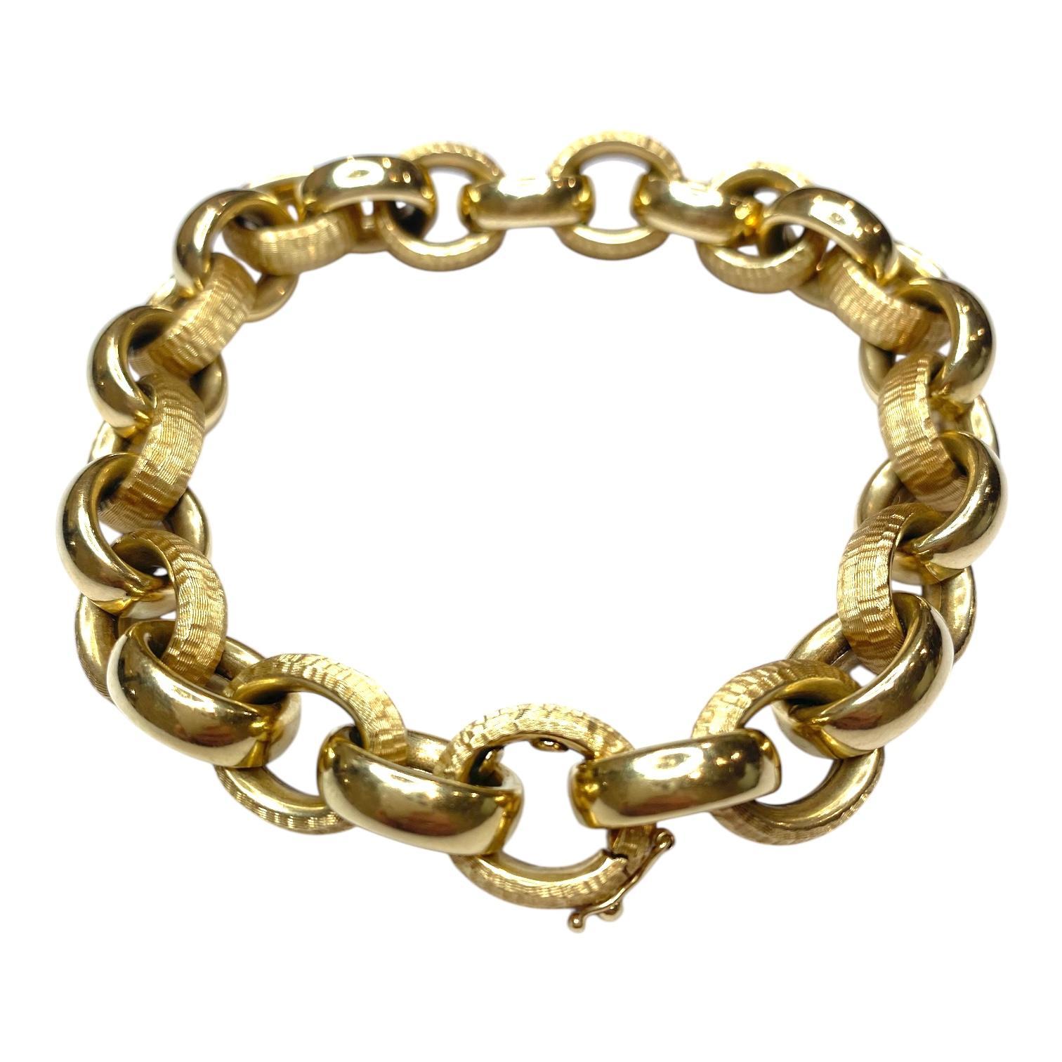 Vintage Italian 14K yellow gold bracelet composed of a series of interlocking oval links with alternating polished and textured finish. Concealed clasp with safety.
Measurements:
Length: 9.5 inches (Shortening possible by removing links by a