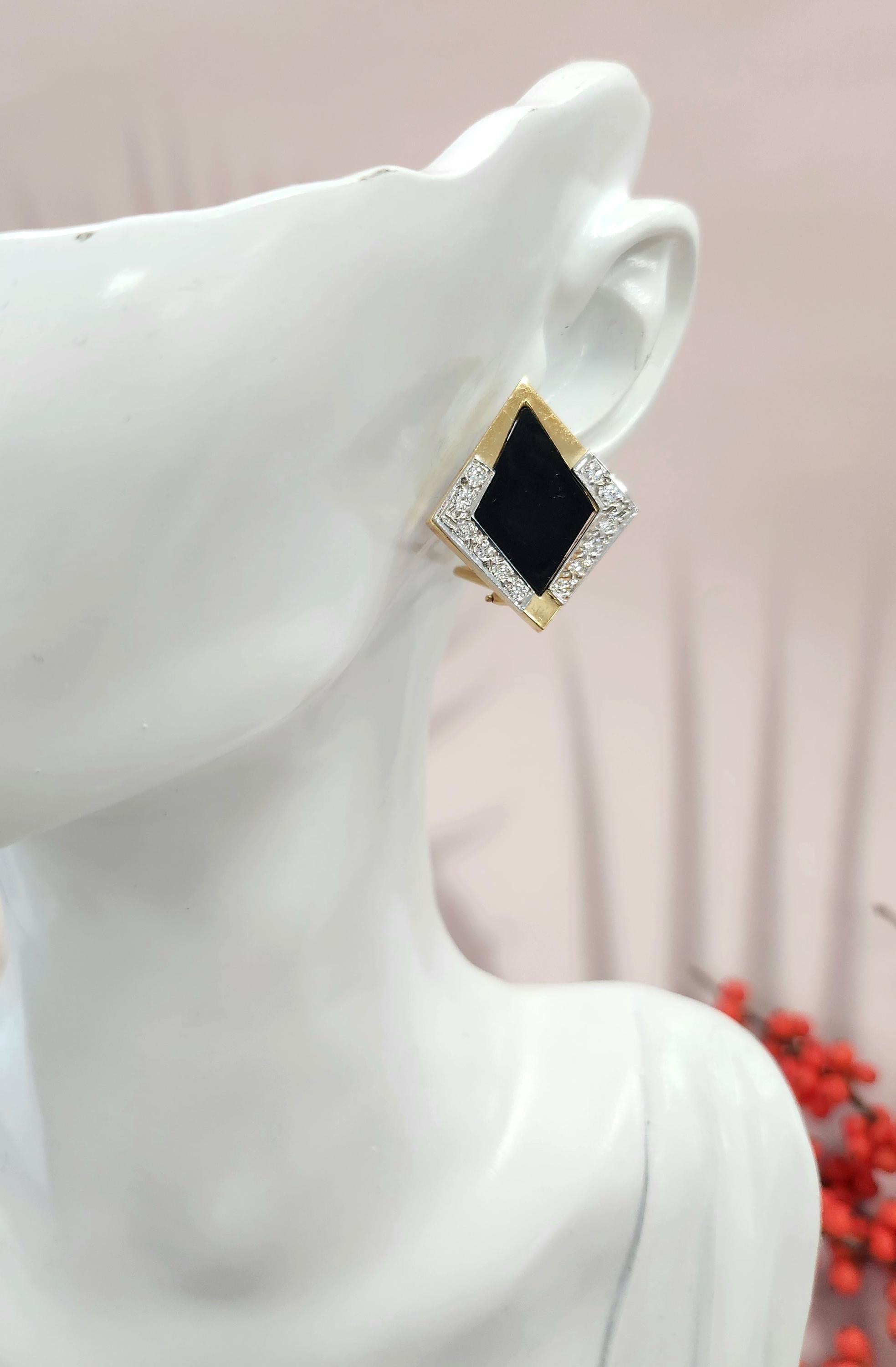 These are a pair of vintage onyx and diamond stud earrings.
Details:

Metal: 14k gold (two-tone)
Gemstones: Natural onyx and 0.45 carats of white diamonds
Backing: Comfortable and secure lever backs
Weight: 10.4 grams