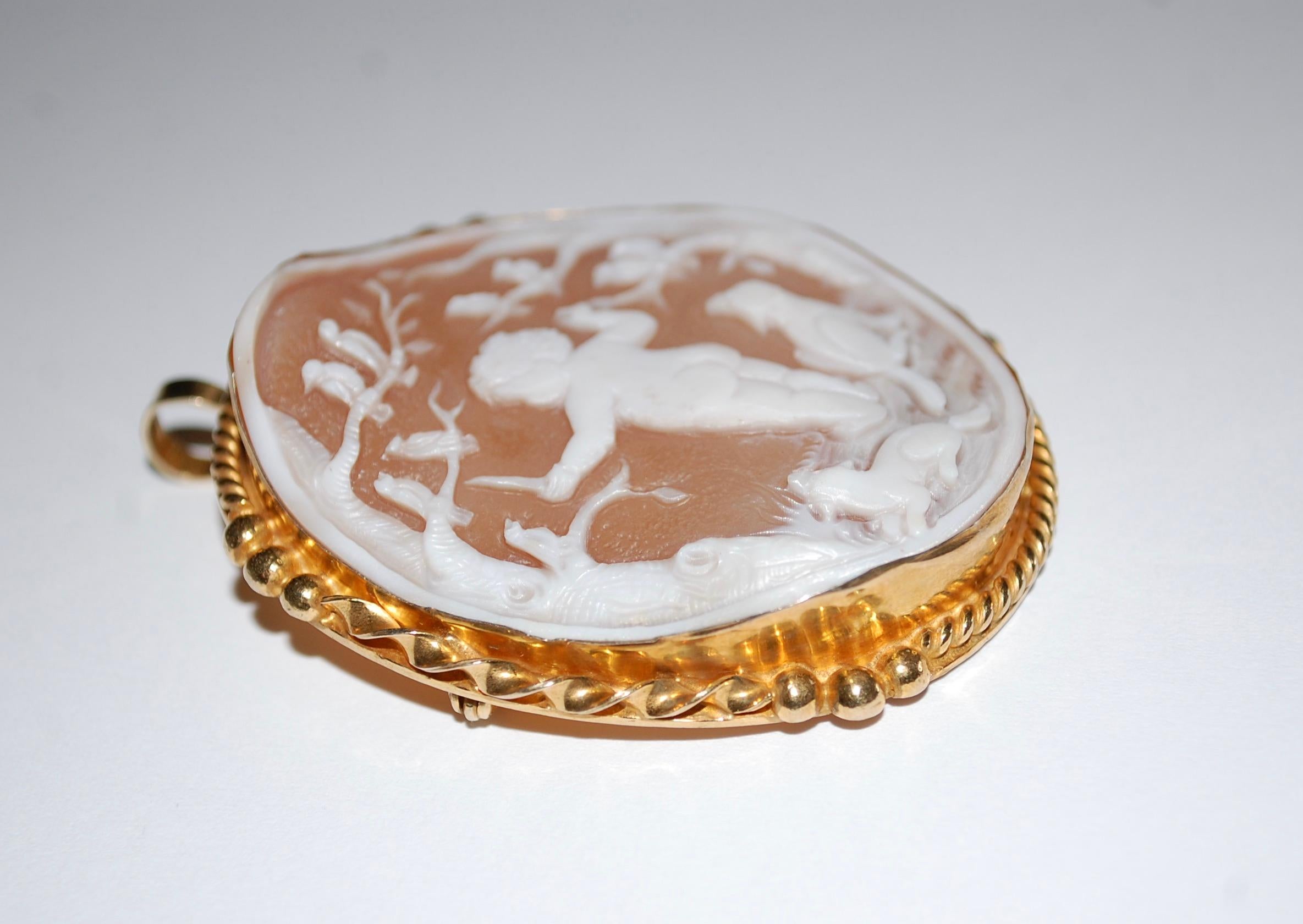 Vintage Large Cameo with Putti  Singing Birds and Dogs
Charming large oval shape cameo pendant or brooch set in tested 14K yellow gold, illegible artist signed on the back. A wonderful quality to showcase the intricate detail work that makes cameos
