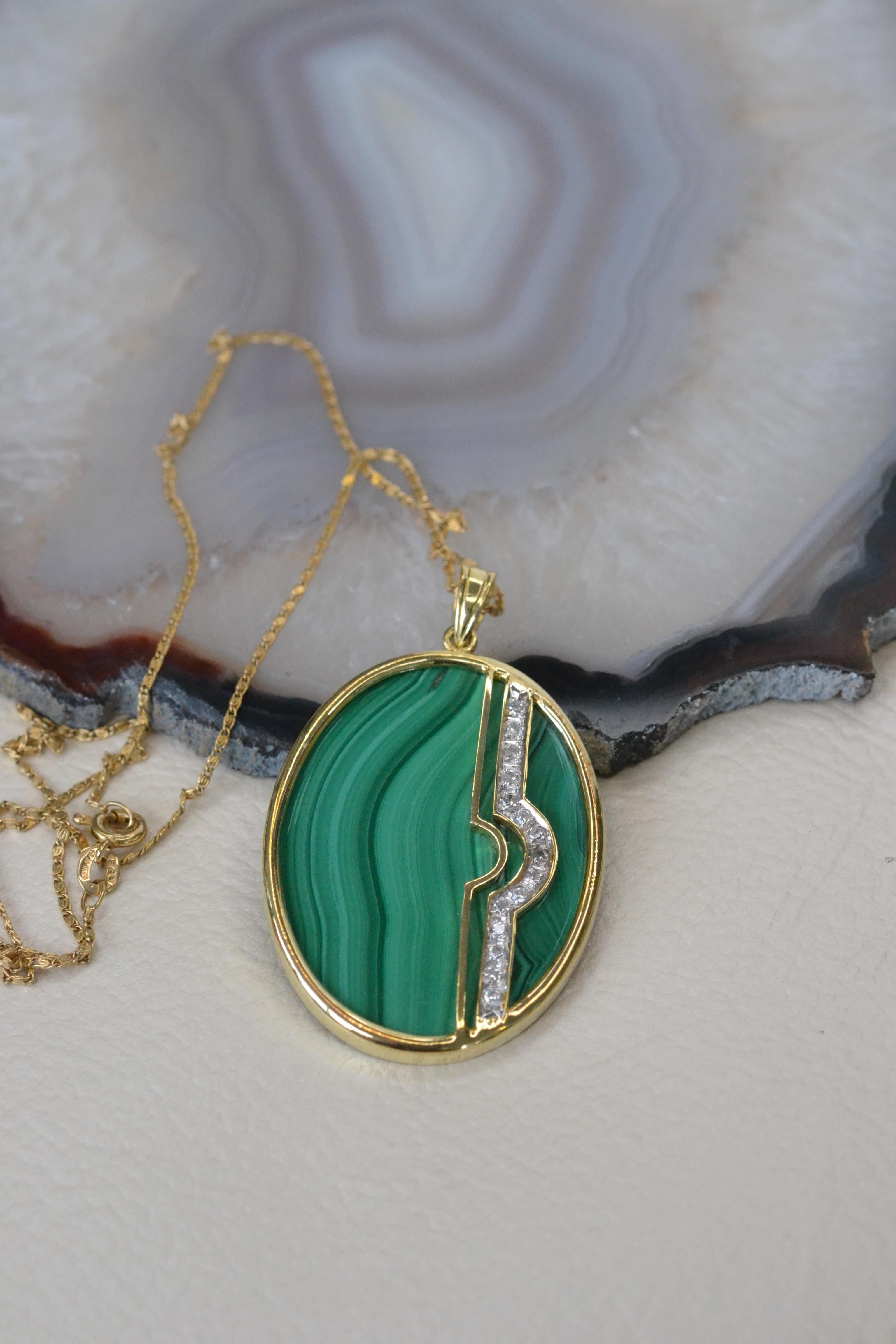 Vintage 14k Gold Malachite and Diamond Pendant

This unique malachite pendant made in the 1980s is the perfect statement necklace: bright, bold and sparkly. The stripe of white diamonds add an extra dazzle to this eye-catching piece and this