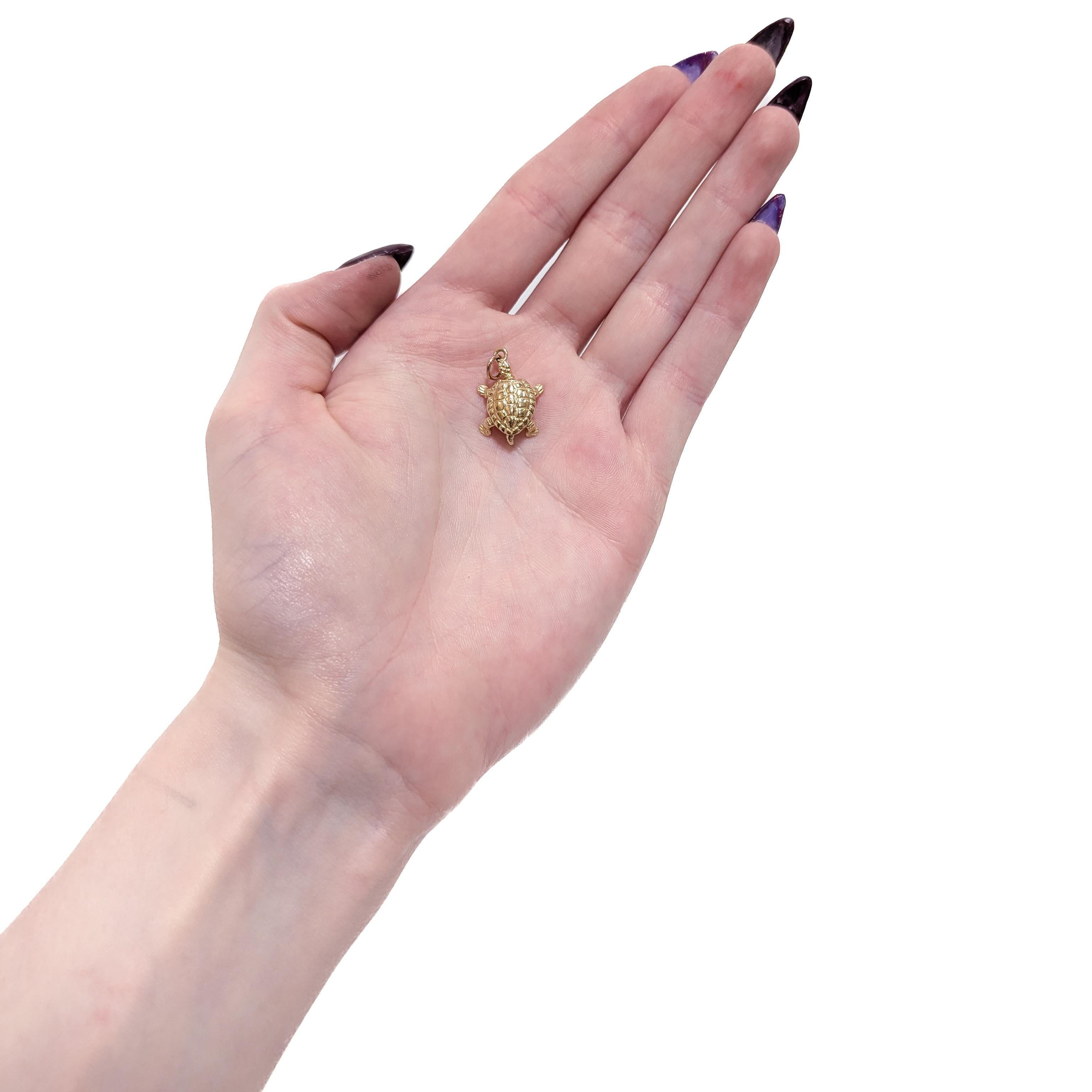 A fine vintage figural gold charm for a bracelet.

In 14 karat yellow gold.

In the form of a turtle or tortoise with articulating head, legs, and tail.

With an integral bail and jump ring to the mouth.

Simply a wonderful chelonian charm!

(Chain