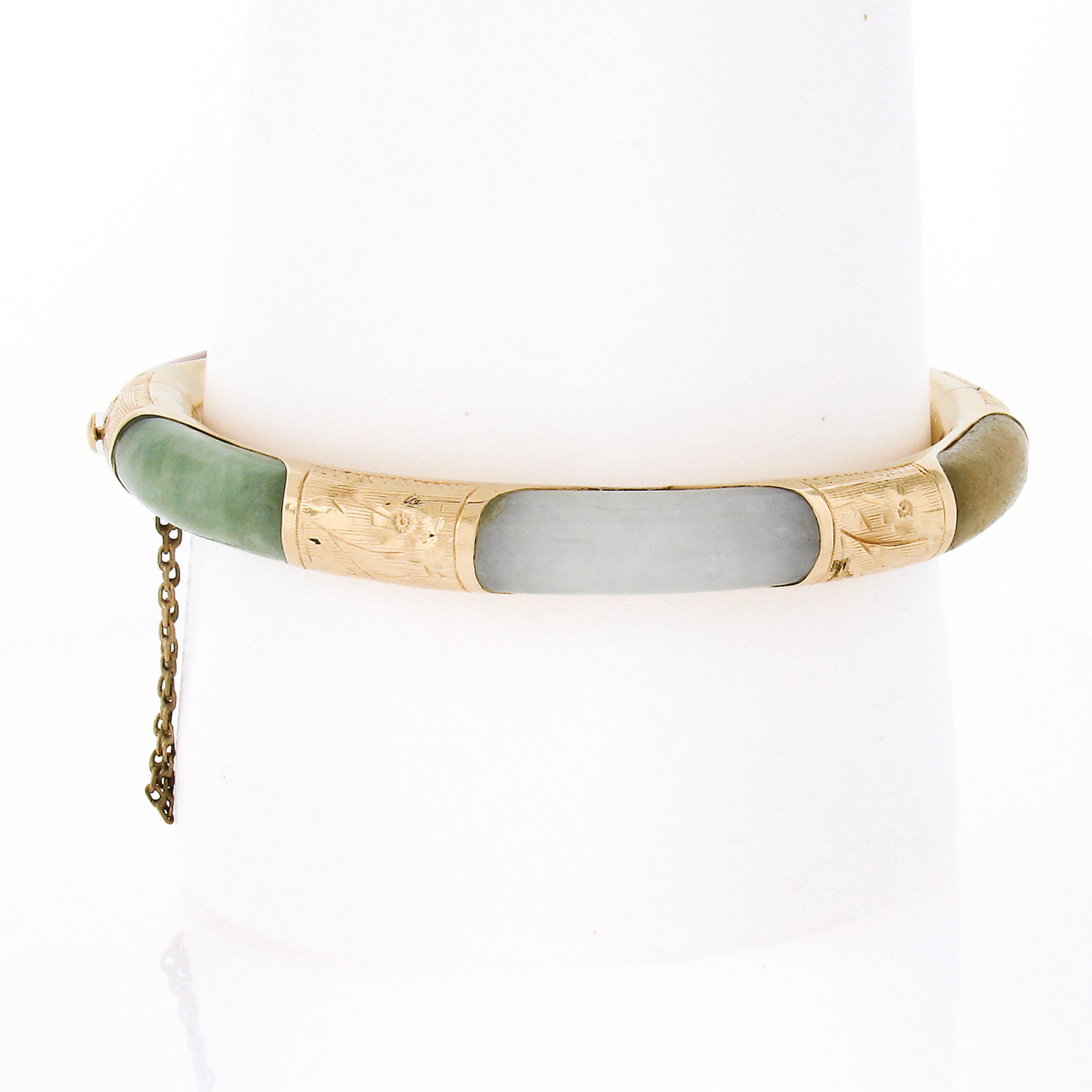 This unique vintage bracelet was crafted in solid 14k yellow gold and features 6 long and curved jade stones - each showing a different color including orange, light green, gray, white, yellow, and black color. The jades are nicely set at the