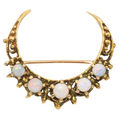 Broche vintage de oro de 14 quilates con luna creciente de ópalo