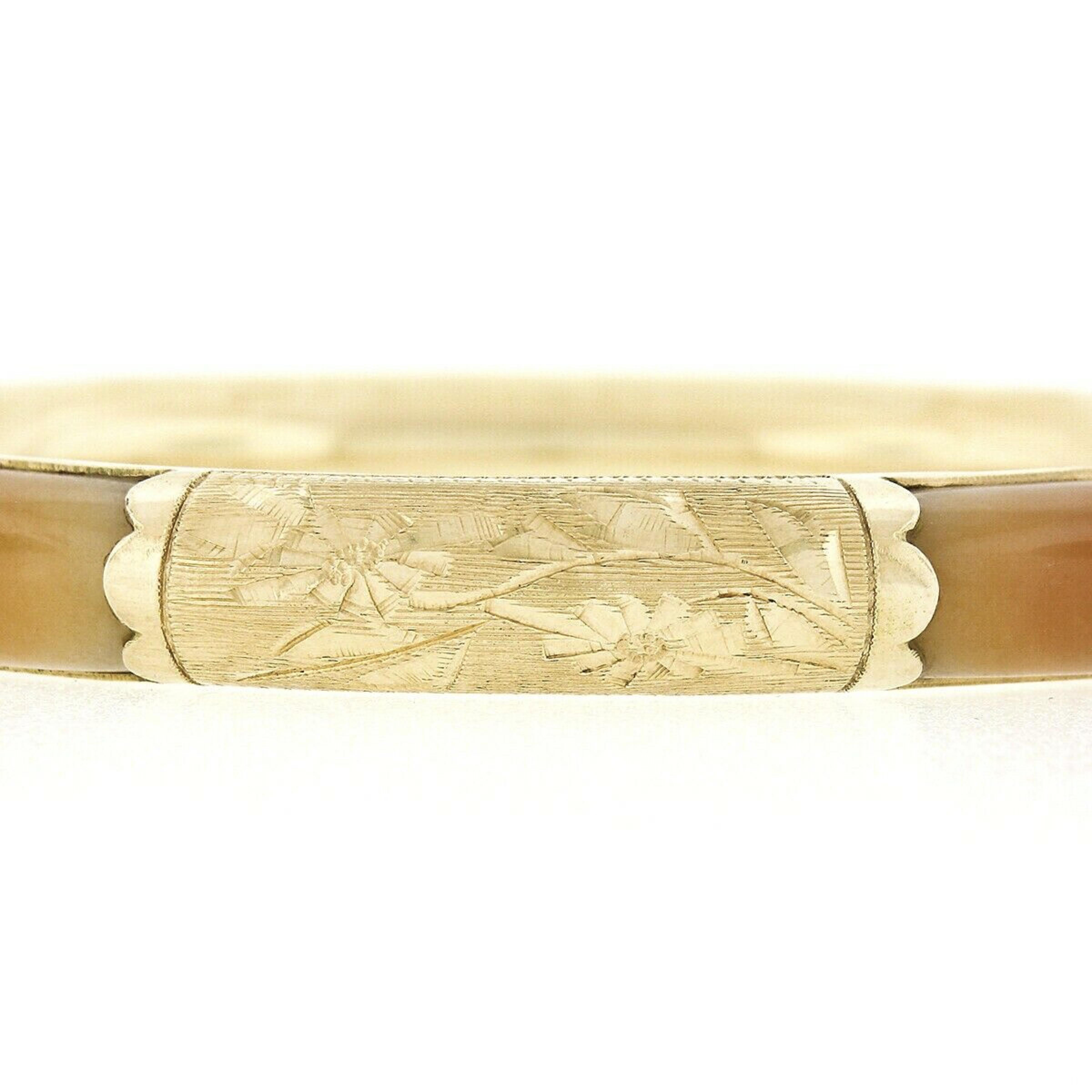 This beautiful vintage bangle bracelet is very well crafted in solid 14k yellow gold and features fine quality natural jade stones neatly stationed and set throughout. The 4 custom cabochon cut stones have a light to medium creamy orange color that